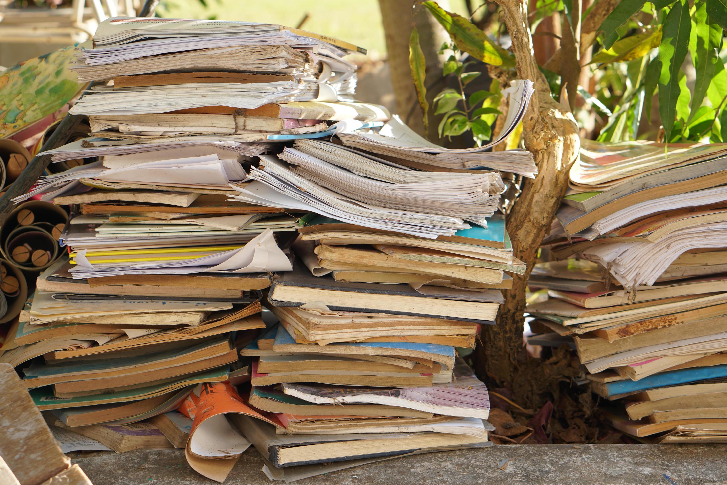 Stacks of old papers and books waiting to be recycled. 17521604 Stock Photo at Vecteezy