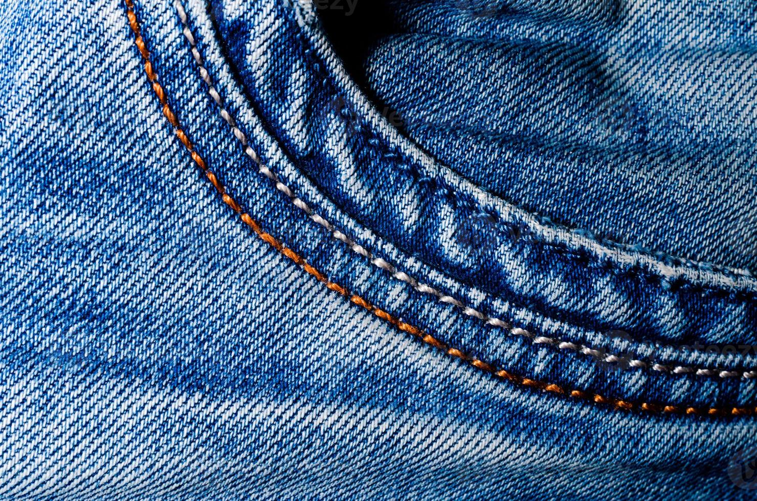 texture pocket of blue crumpled jeans macro closeup photo