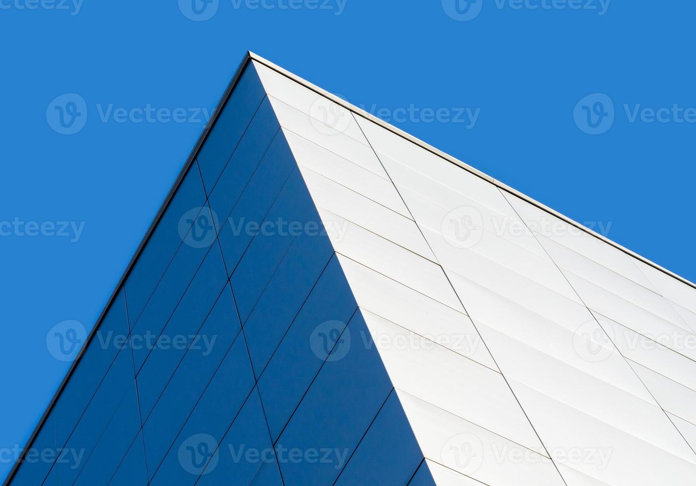 fragment corner of a modern building on a blue background photo