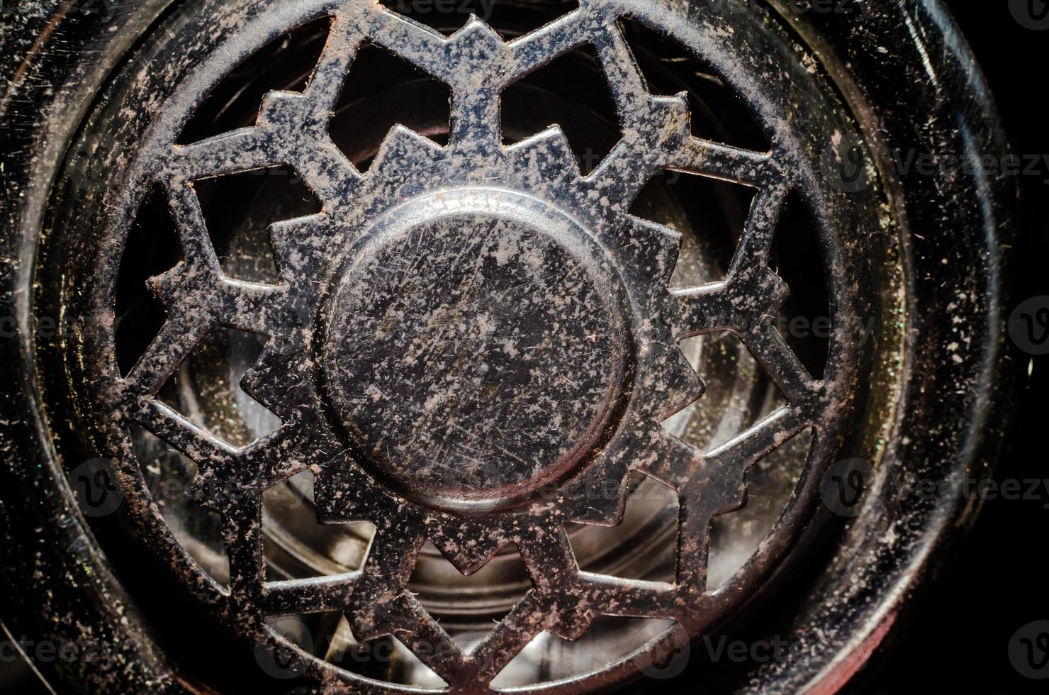 fragment of an old vinyl record player a metal pickup close-up macro photo