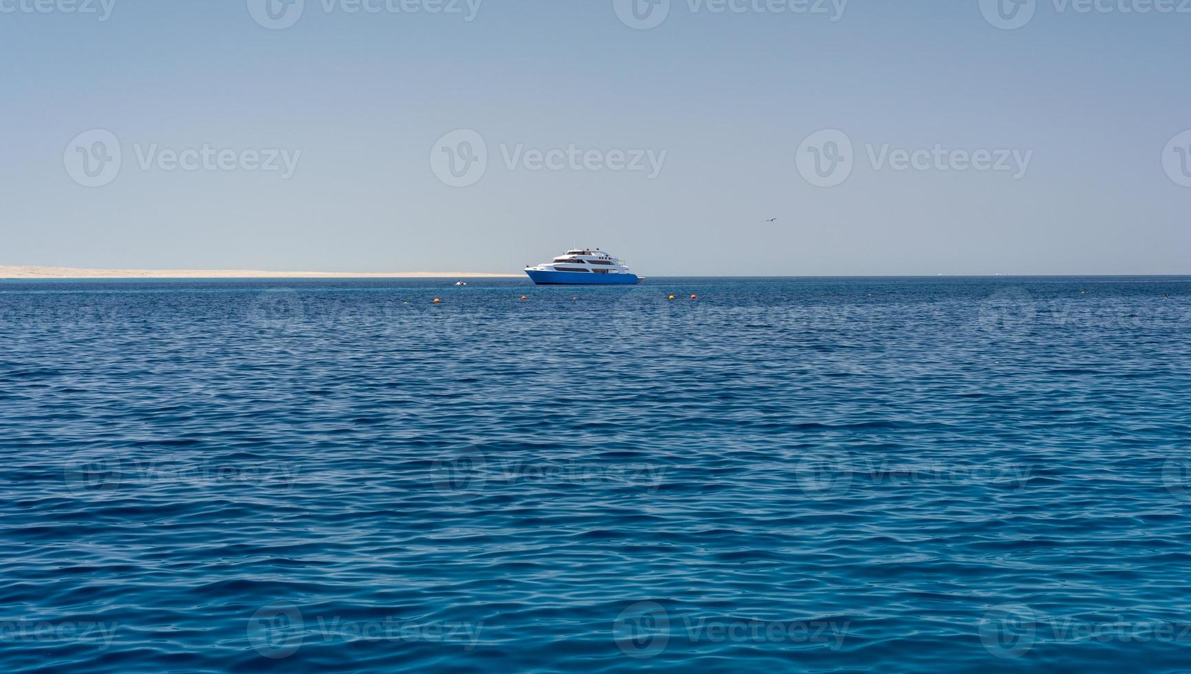 pleasure boat in the blue water of the Red Sea in Egypt photo