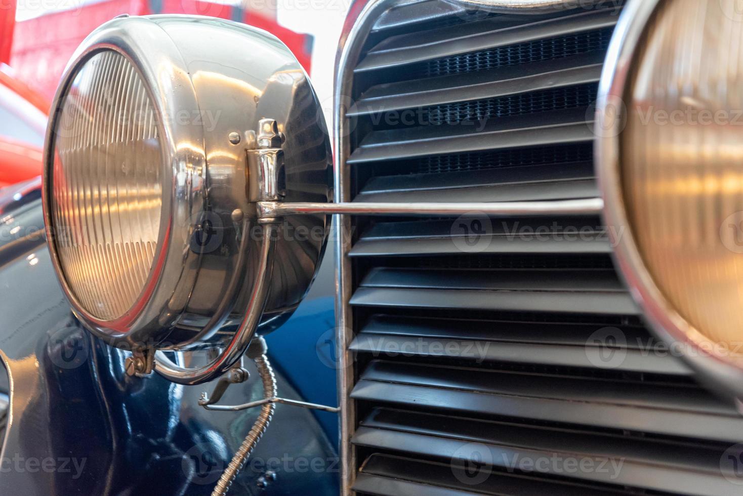 radiator grille and headlight of retro car photo