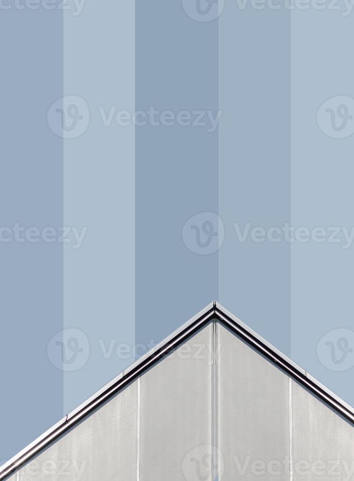 corner of a gray concrete building with windows photo
