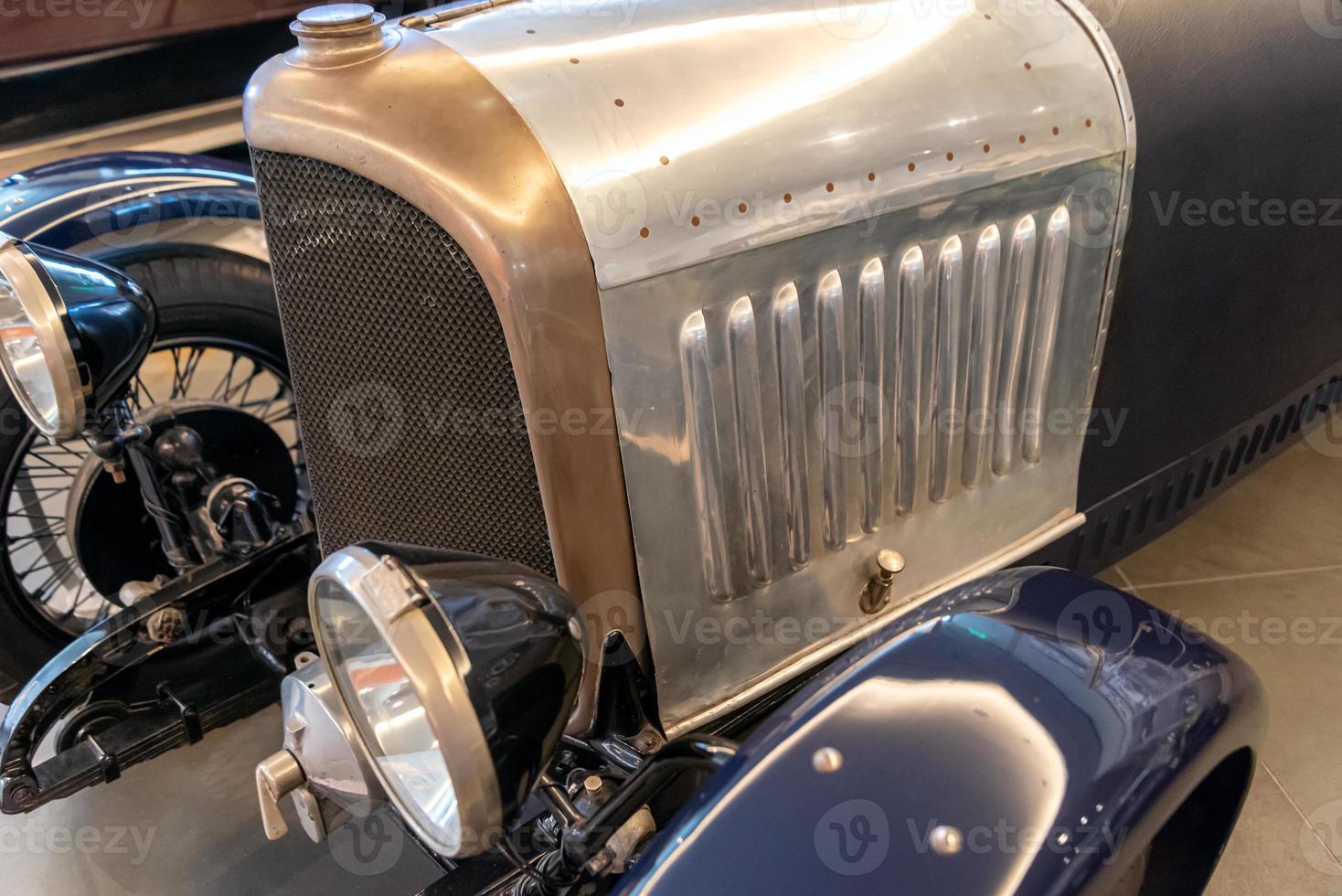 radiator grille and headlight of retro car photo