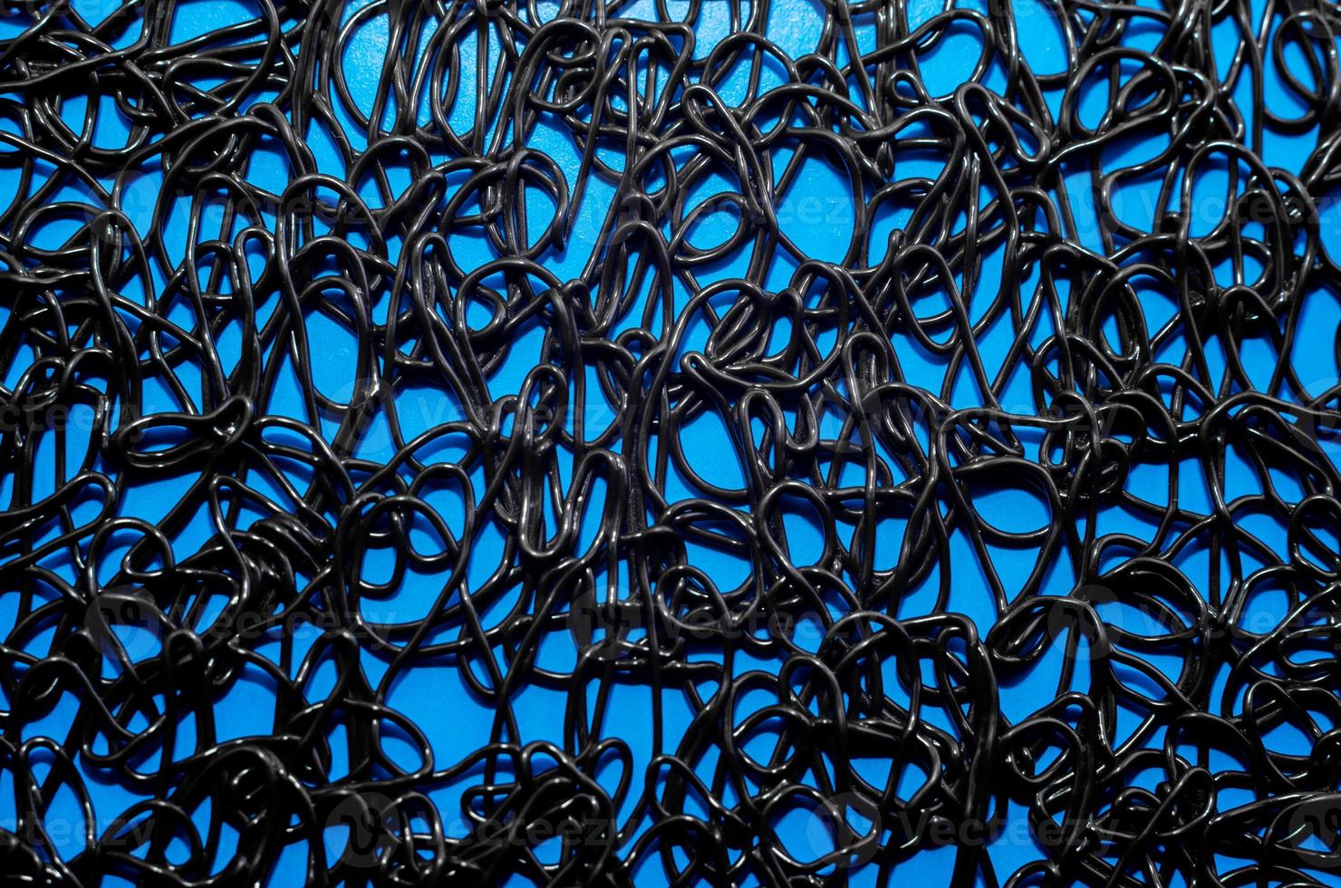 texture pattern of dark brown rubber on a blue background photo