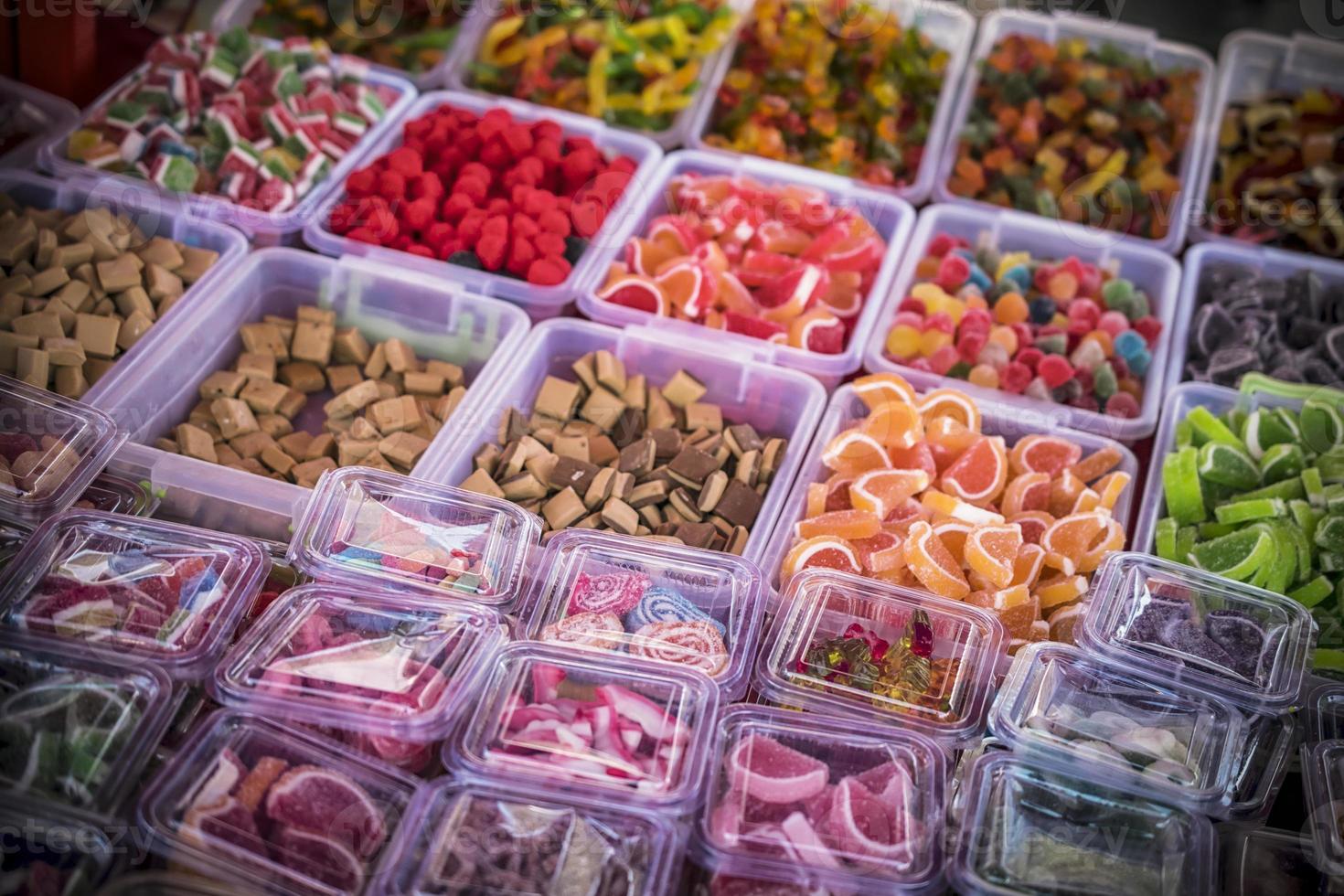 Assorted multicolored handmade sweets on the stall at the marketplace photo