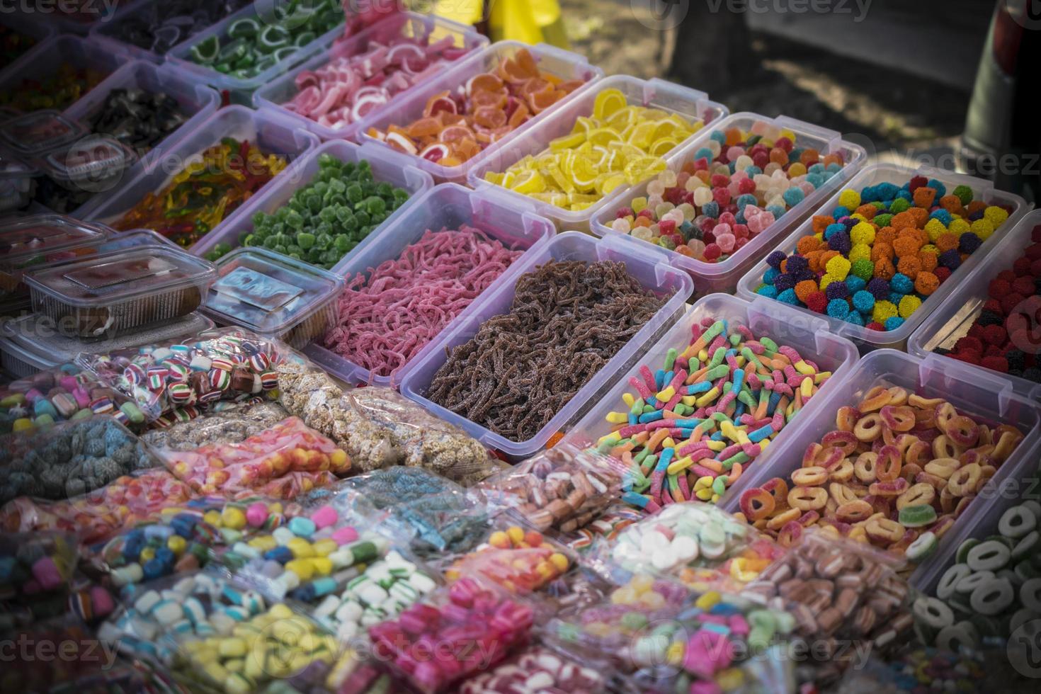 Assorted multicolored handmade sweets on the stall at the marketplace photo