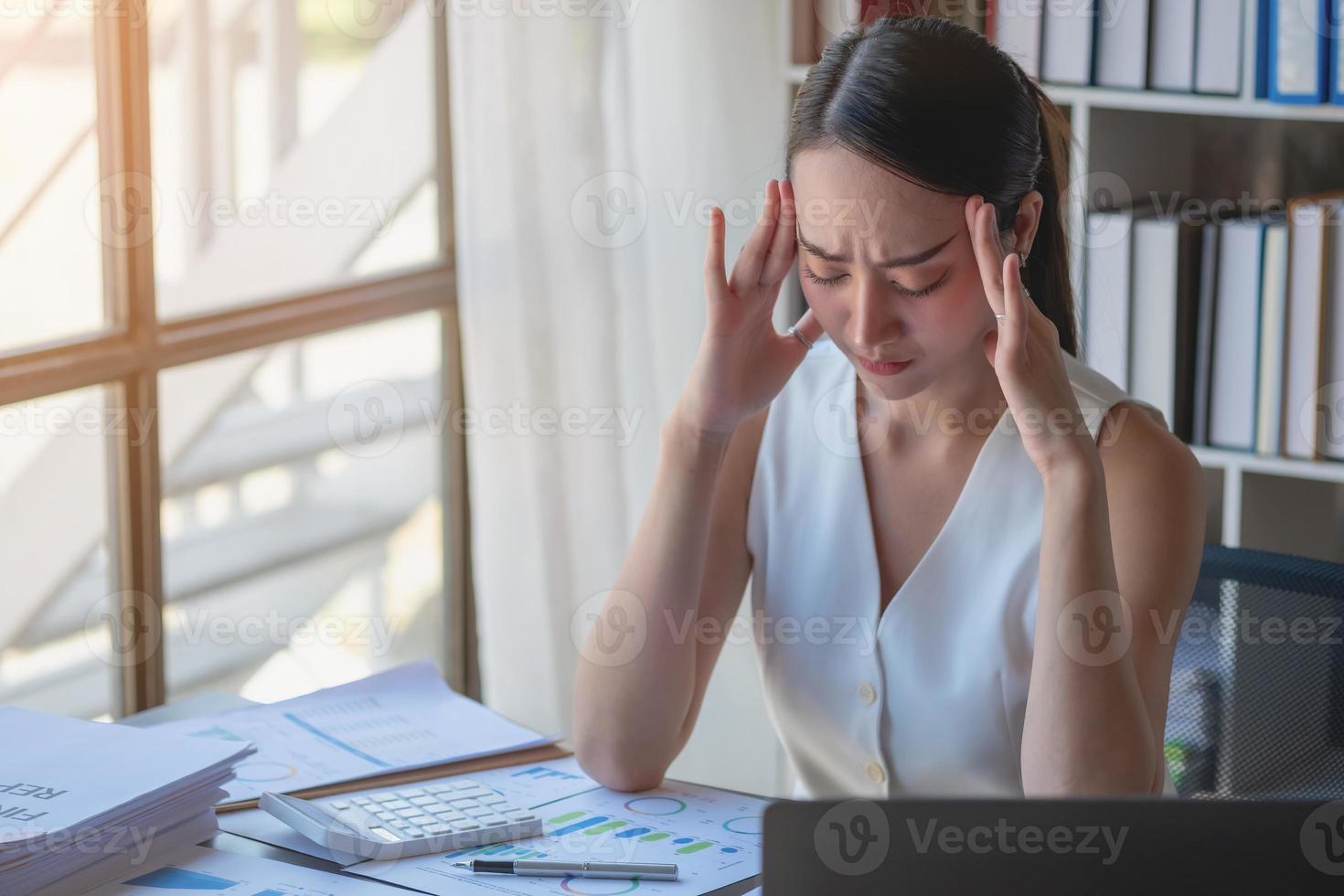 Concept Burnout Syndrome. Business Woman feels uncomfortable working. Which is caused by stress, accumulated from unsuccessful work And less resting body. Consult a specialist psychiatrist. photo