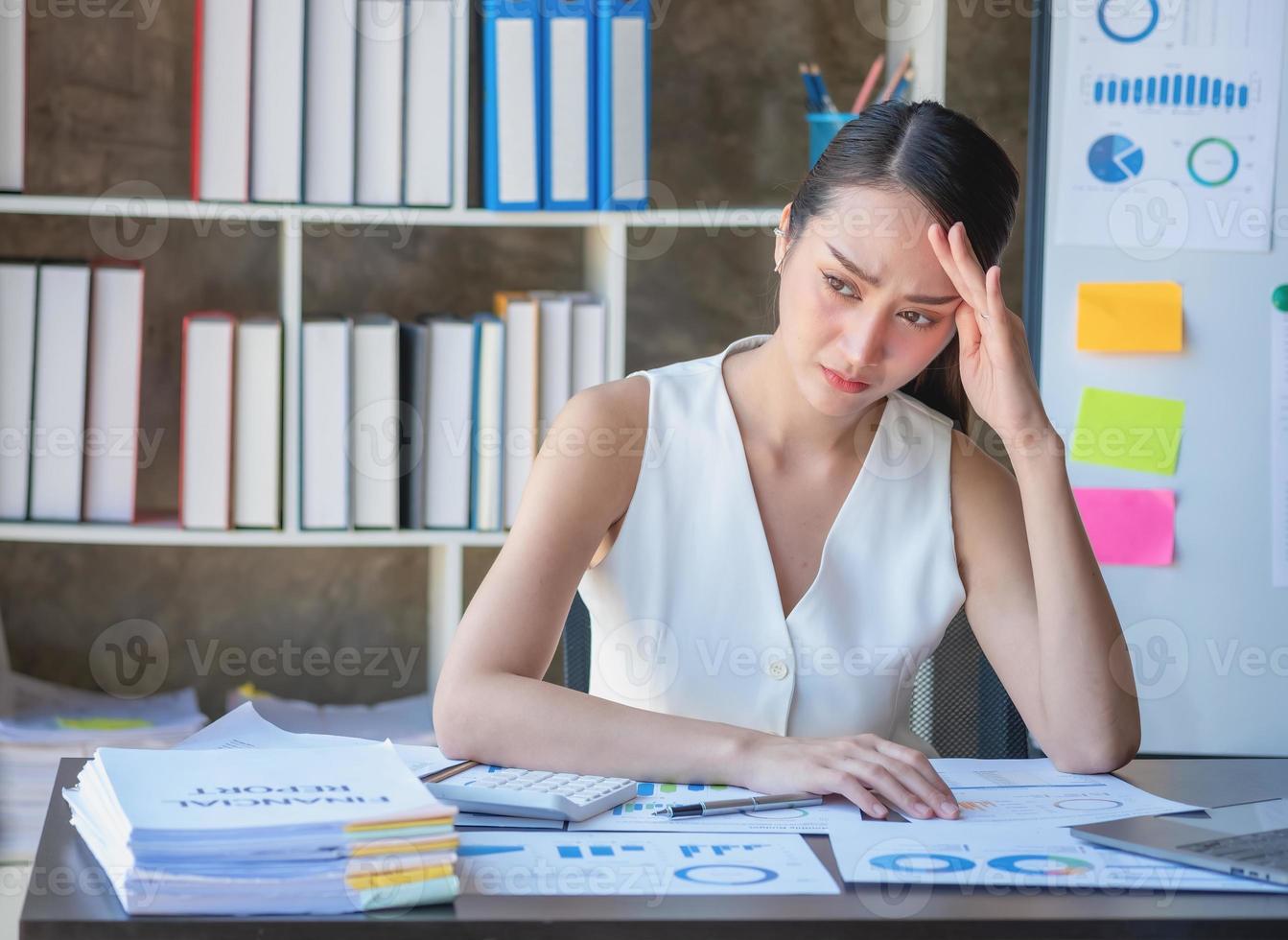 Concept Burnout Syndrome. Business Woman feels uncomfortable working. Which is caused by stress, accumulated from unsuccessful work And less resting body. Consult a specialist psychiatrist. photo