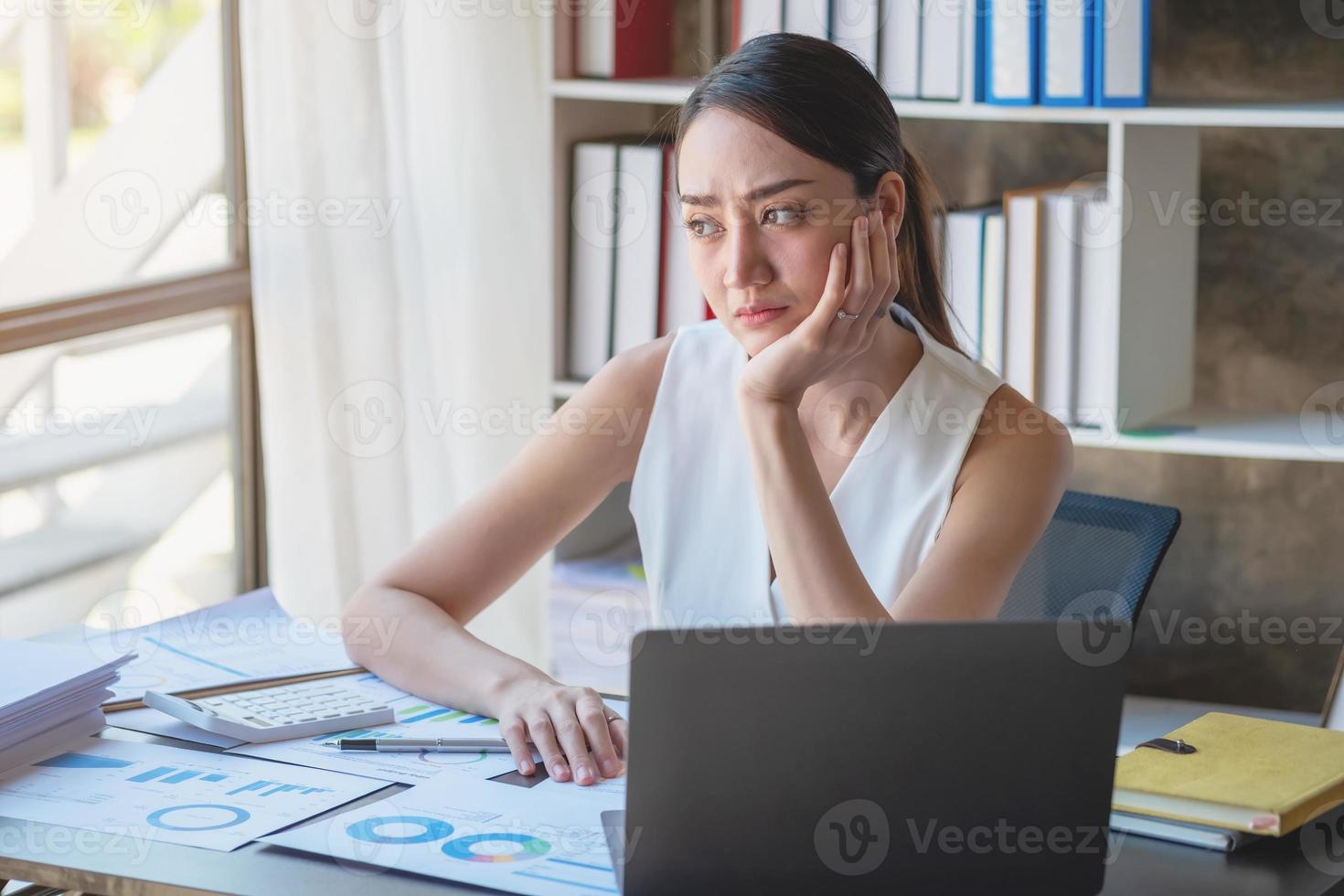 Concept Burnout Syndrome. Business Woman feels uncomfortable working. Which is caused by stress, accumulated from unsuccessful work And less resting body. Consult a specialist psychiatrist. photo