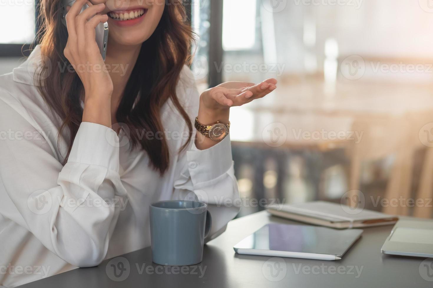 Marketing, Financial, Accounting, Planning, businesswomen uses a mobile phone to contact a customer to inform her of the company is business partnership. photo