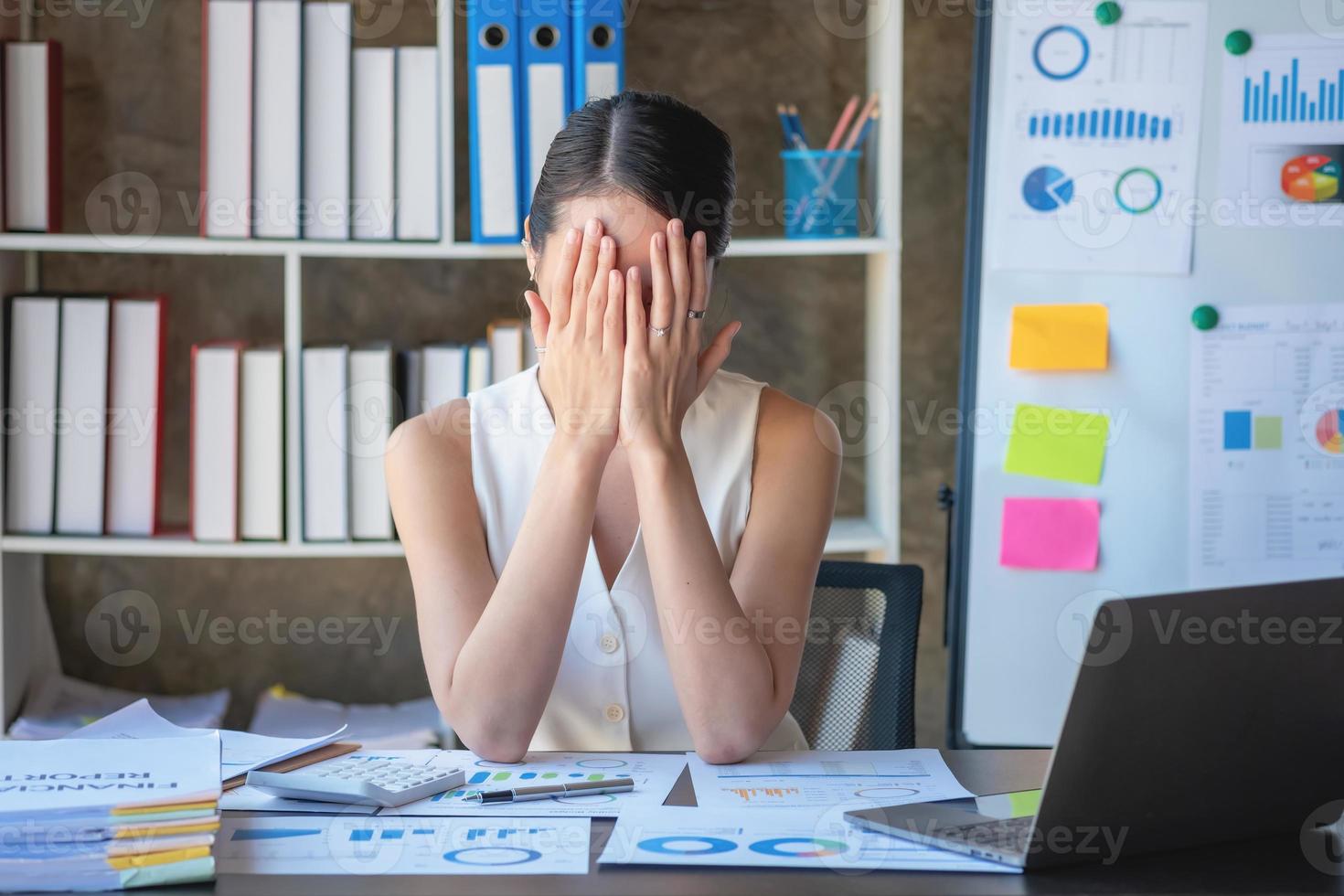 Concept Burnout Syndrome. Business Woman feels uncomfortable working. Which is caused by stress, accumulated from unsuccessful work And less resting body. Consult a specialist psychiatrist. photo