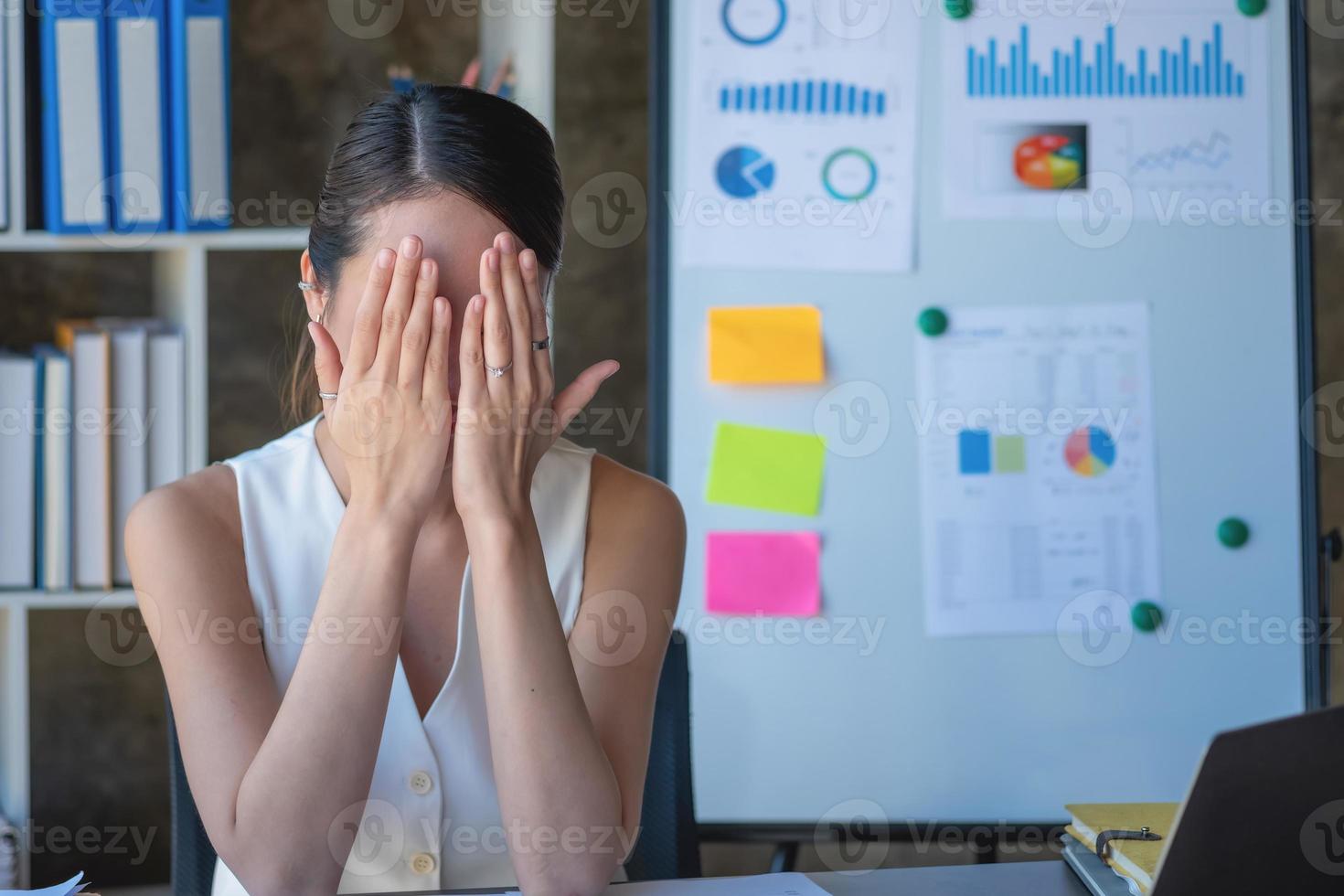 Concept Burnout Syndrome. Business Woman feels uncomfortable working. Which is caused by stress, accumulated from unsuccessful work And less resting body. Consult a specialist psychiatrist. photo