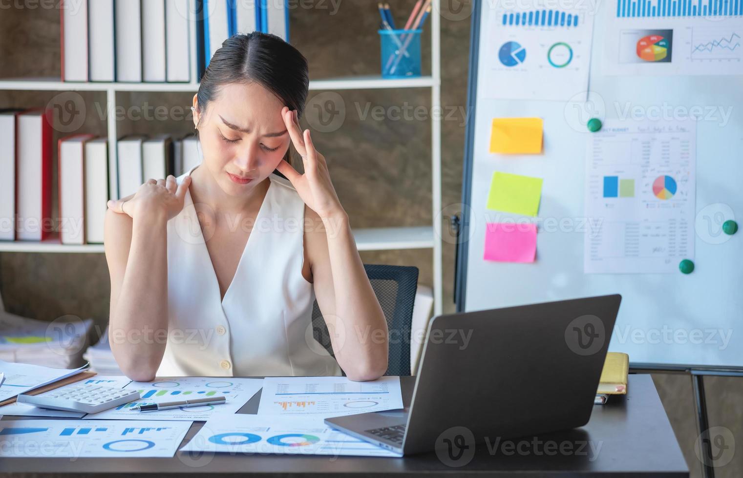 Concept Burnout Syndrome. Business Woman feels uncomfortable working. Which is caused by stress, accumulated from unsuccessful work And less resting body. Consult a specialist psychiatrist. photo