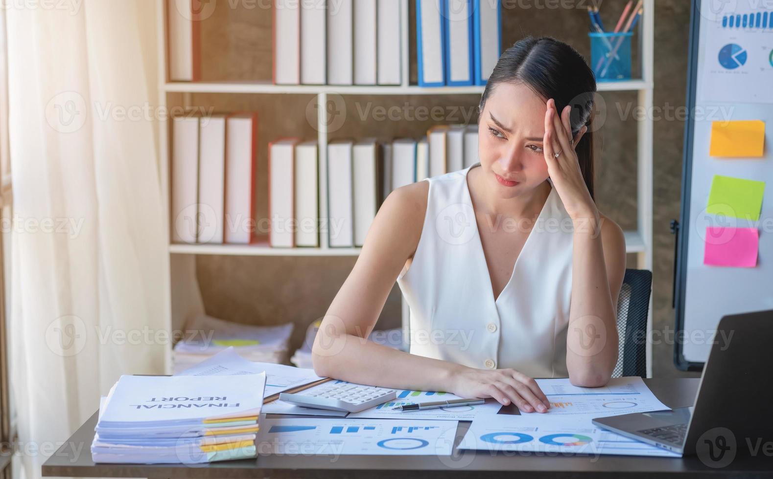 Concept Burnout Syndrome. Business Woman feels uncomfortable working. Which is caused by stress, accumulated from unsuccessful work And less resting body. Consult a specialist psychiatrist. photo