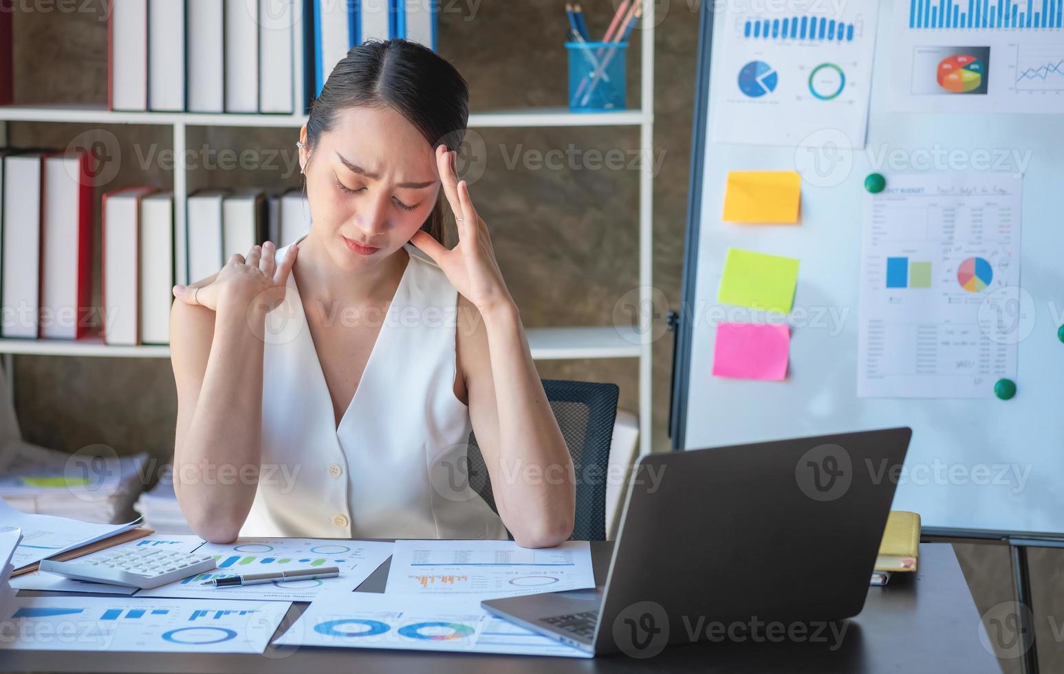 Concept Burnout Syndrome. Business Woman feels uncomfortable working. Which is caused by stress, accumulated from unsuccessful work And less resting body. Consult a specialist psychiatrist. photo