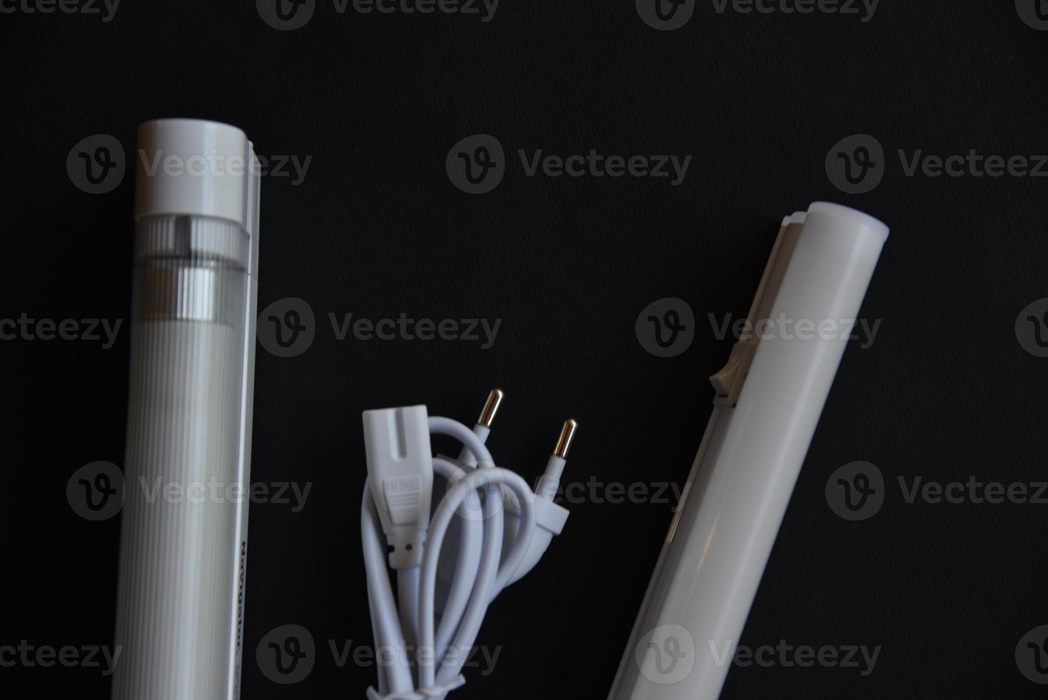 LED lamp on a black background. Lighting device. photo