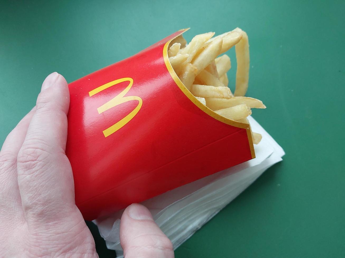 KYIV, UKRAINE - JANUARY 15, 2023 Food from McDonald's Big Mac with potatoes photo