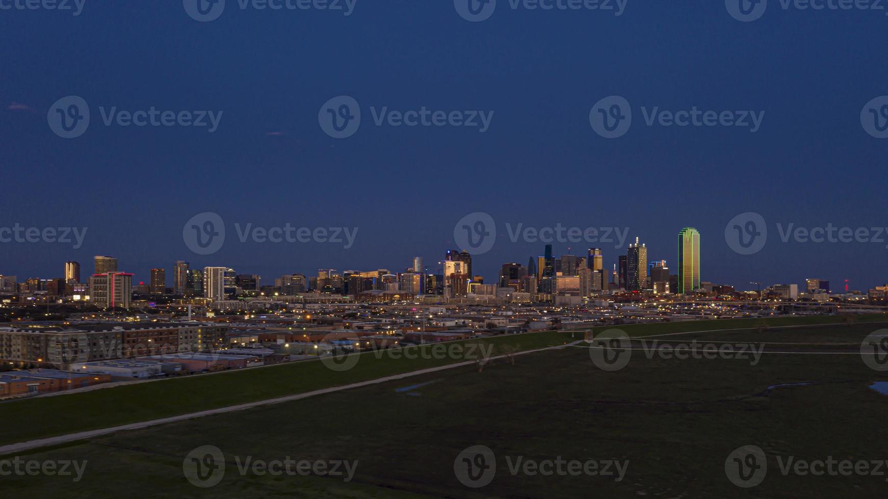 Panoramic aerial drone picture of Dallas skyline and Trammel Crow Park at sunset in winter photo