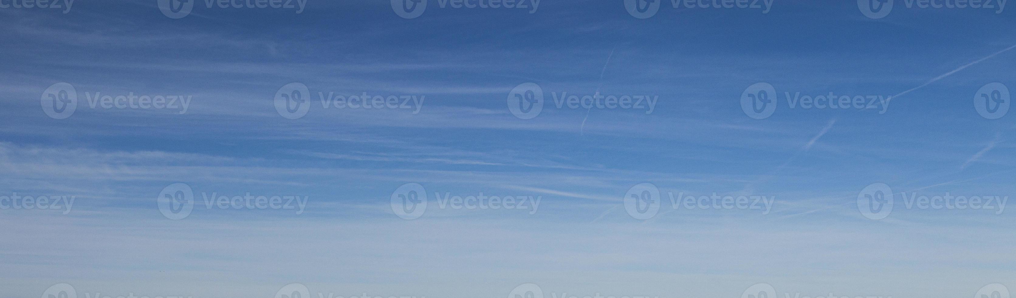 Image of a partly cloudy and partly clear sky during the day photo