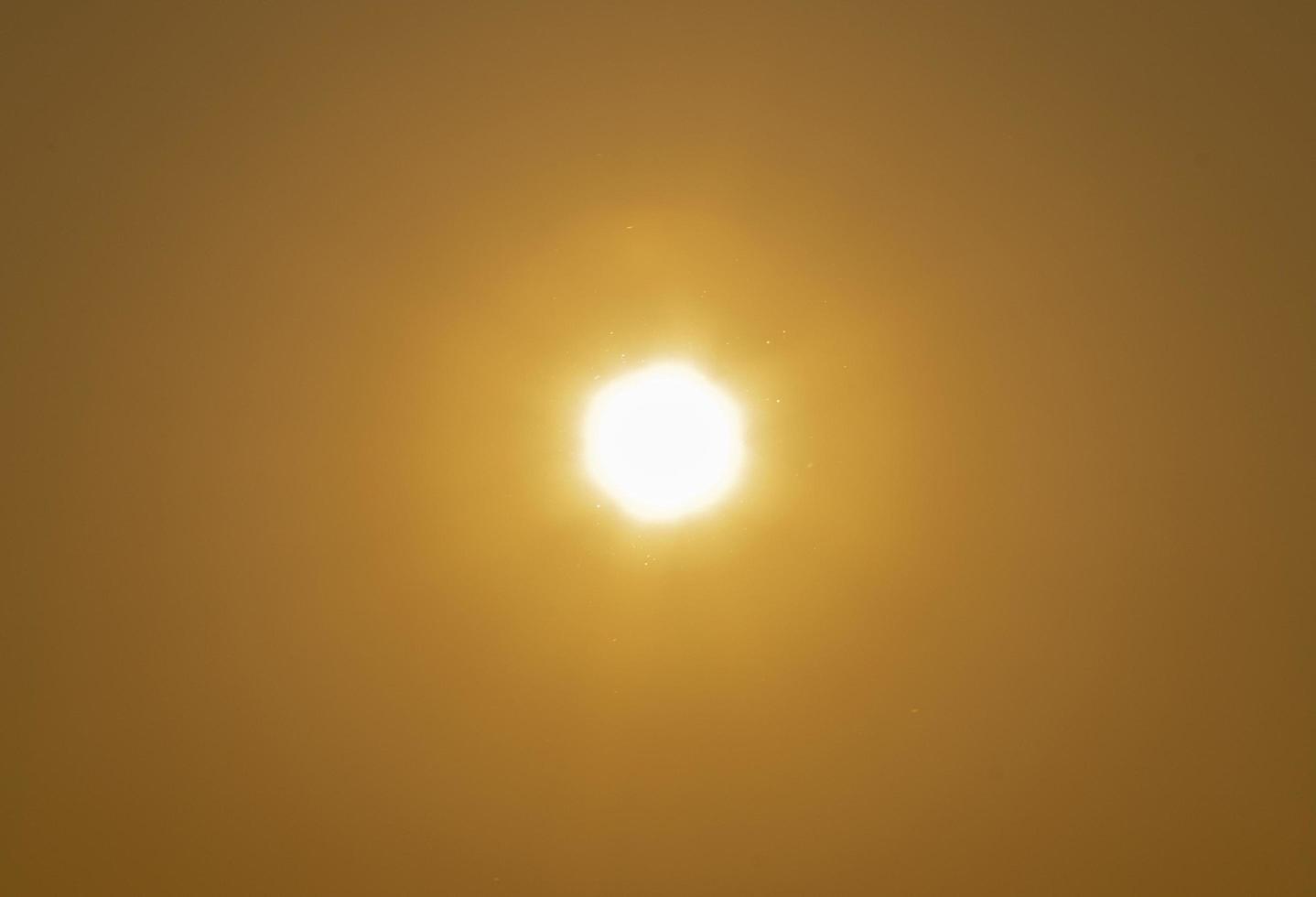 The sun on the yellow sky photo