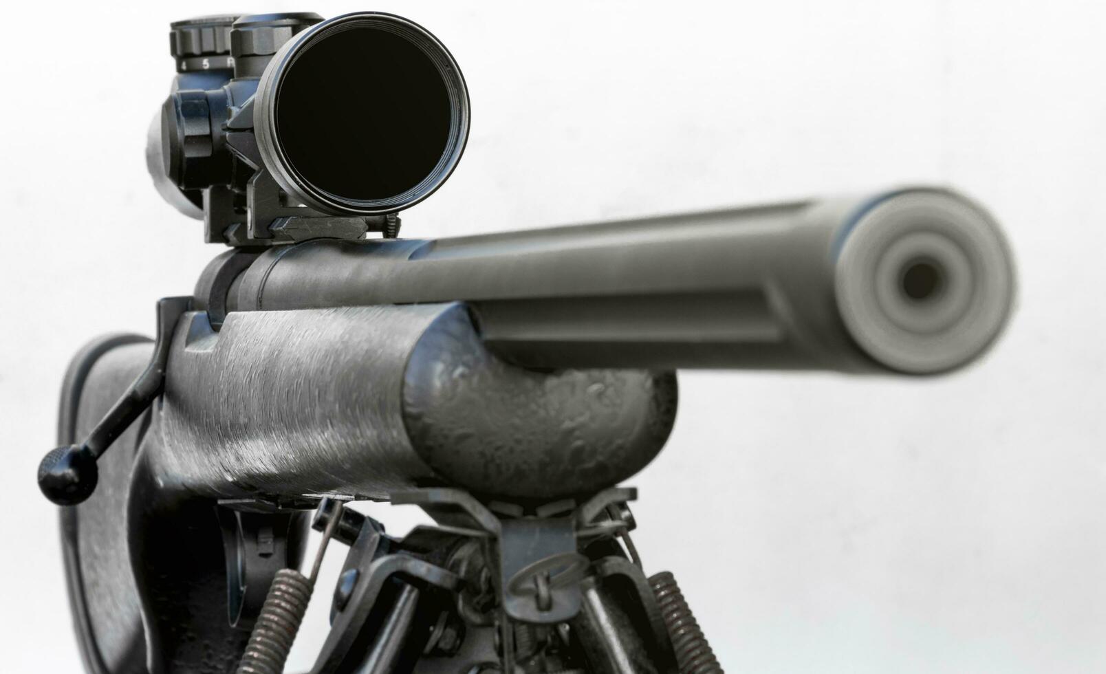 Rifle with a scope and bipod on white background. Focus Scope photo