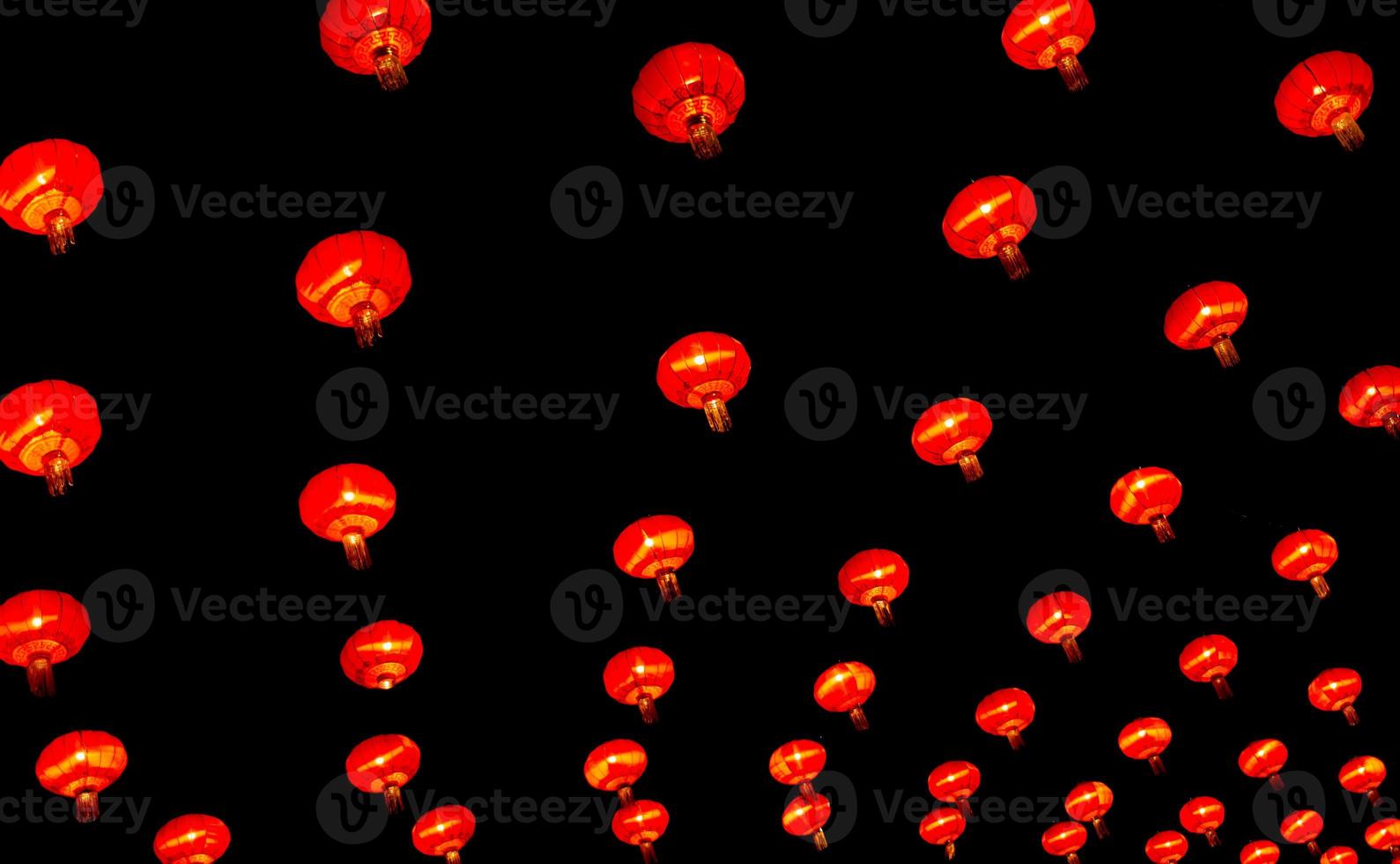 Chinese lantern in new year festival, red lanterns are hung as pattern,black background,Chinese new year concept. photo