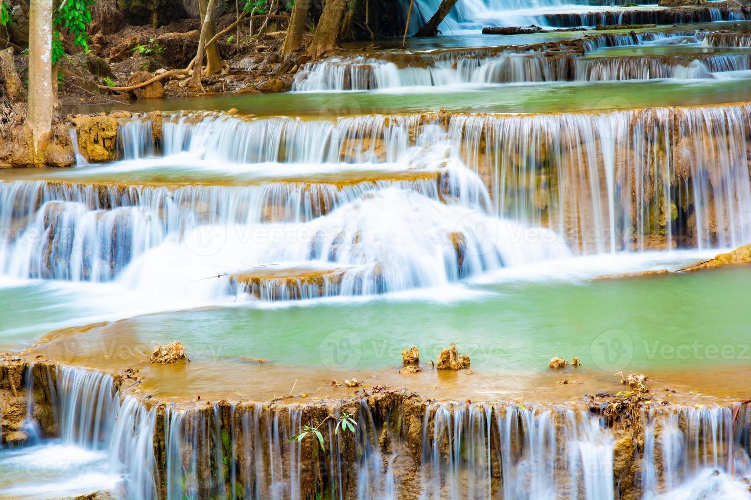 Amazing colorful waterfall in national park forest during spring,beautiful deep forest in Thailand,technic long exposure, during vacation and relax time. photo