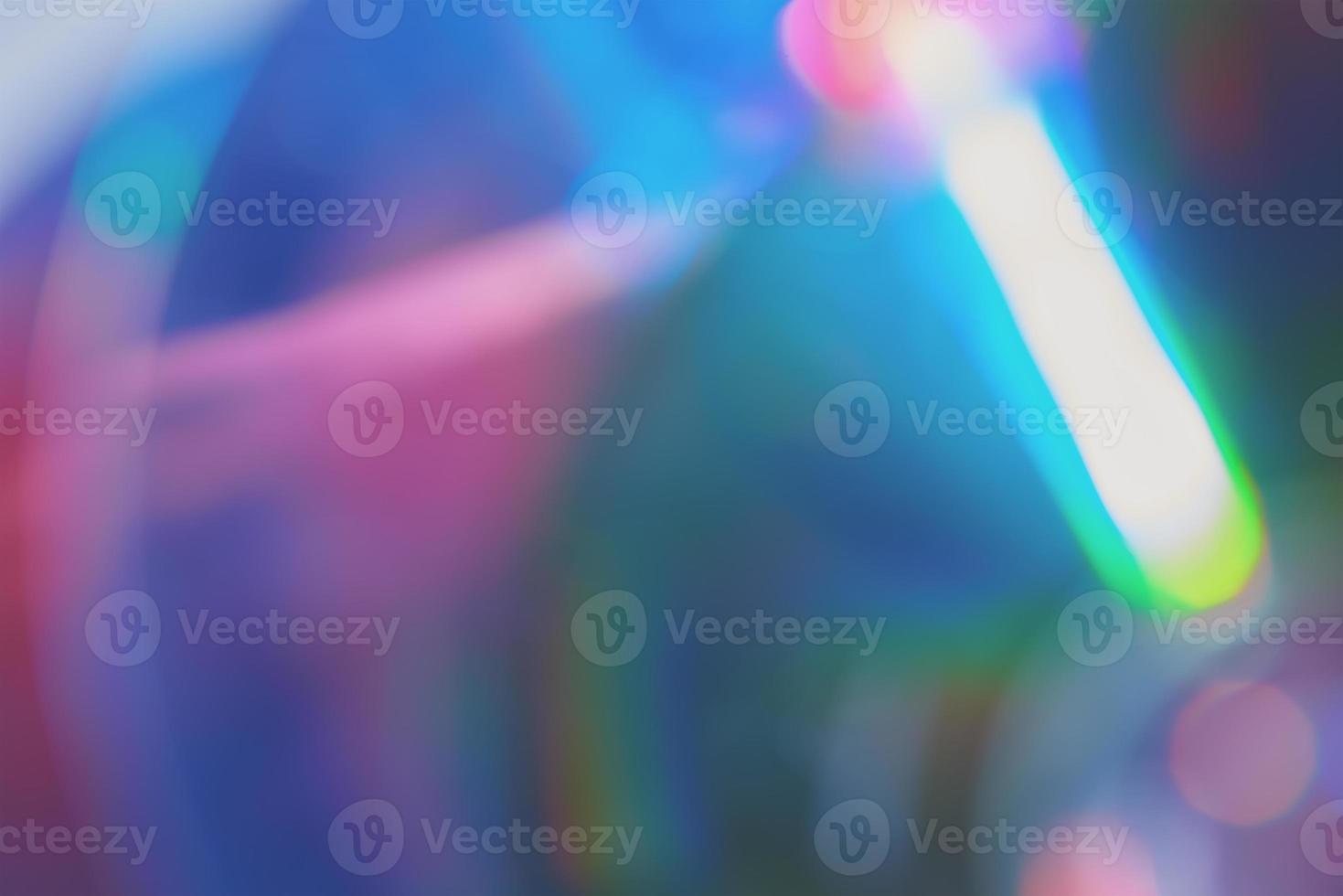Blurred rainbow colored light flare background. photo