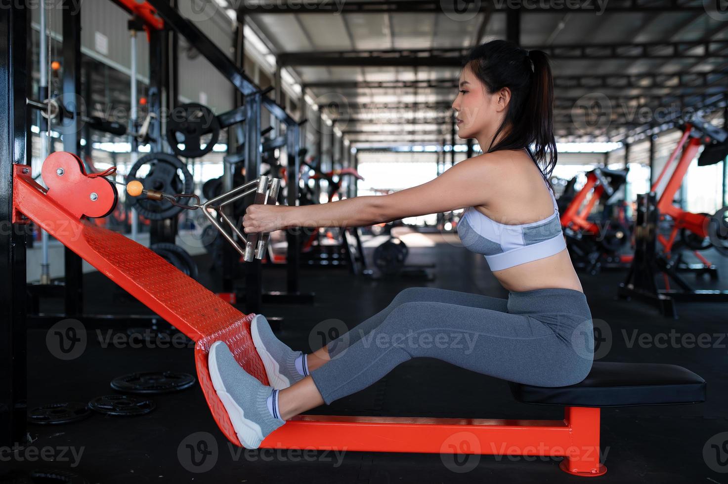 Close up asian beautiful sportswoman wear sport bra on wall of gym,Thailand love health,Slim woman workout concept photo