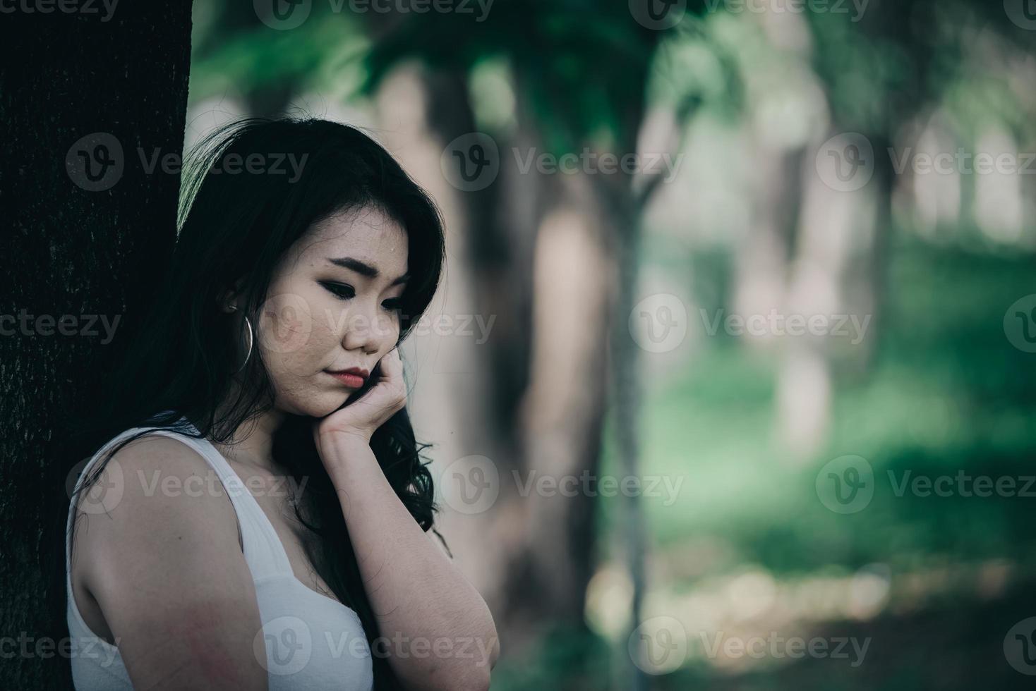 Lonely Sad fat woman ,She think over from love,heartbreak,Heartbroken because of disappointment,Thailand people photo