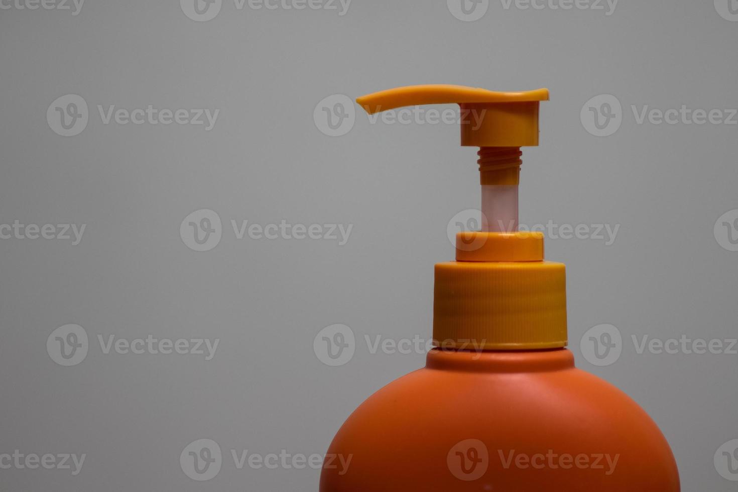 Picture Of Orange Pump Head Shower Gel photo