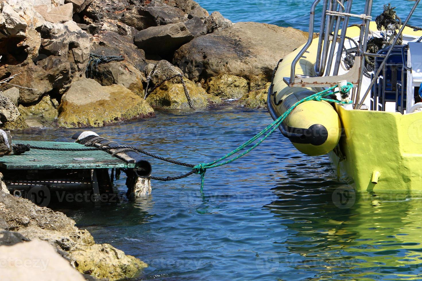 Berth on the seashore for mooring boats and yachts. photo