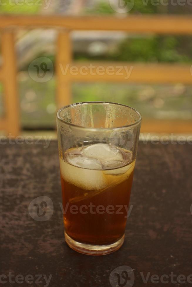 sweet fresh iced tea with blur background. photo