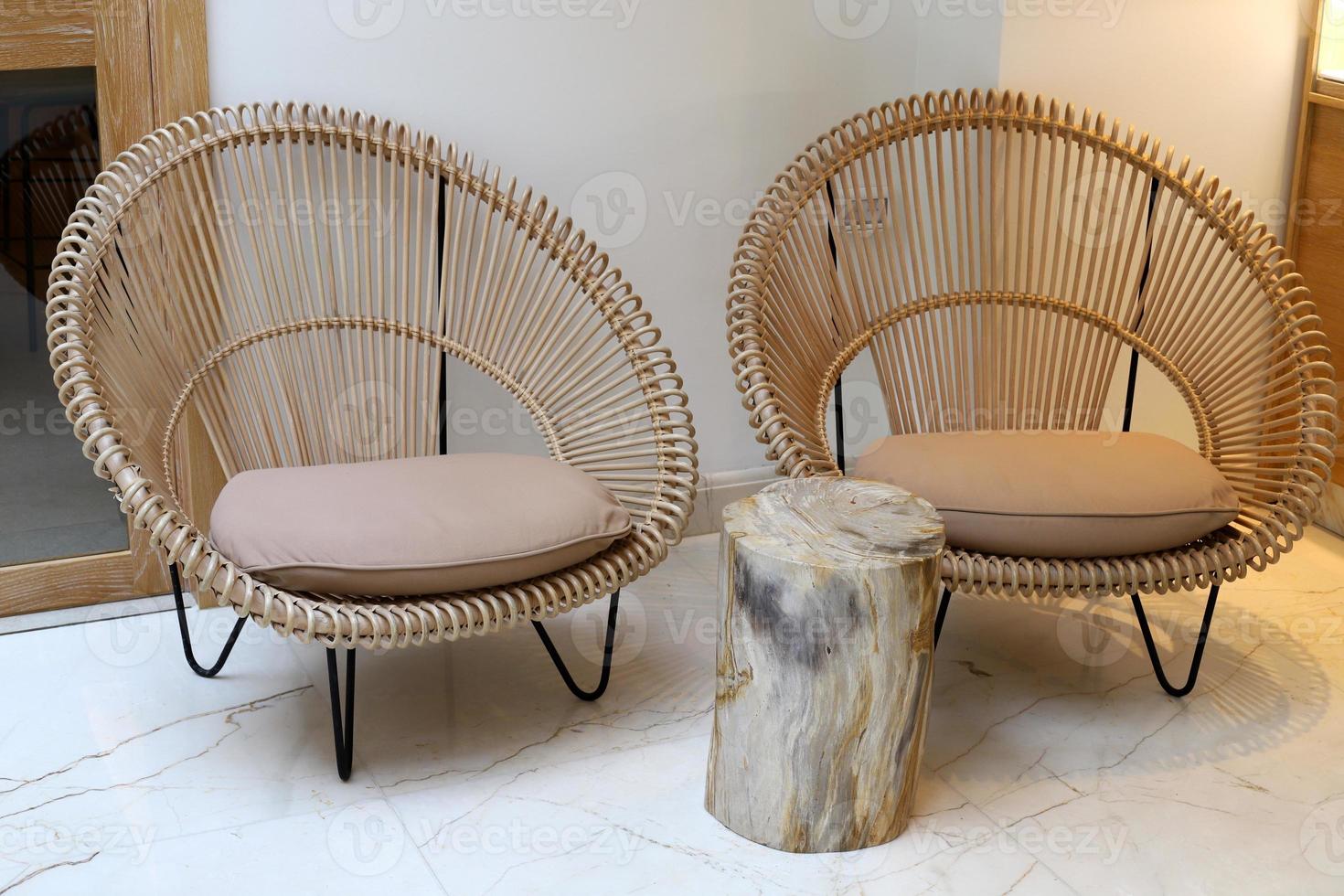 Chair and table in a cafe in a city park near the sea. photo