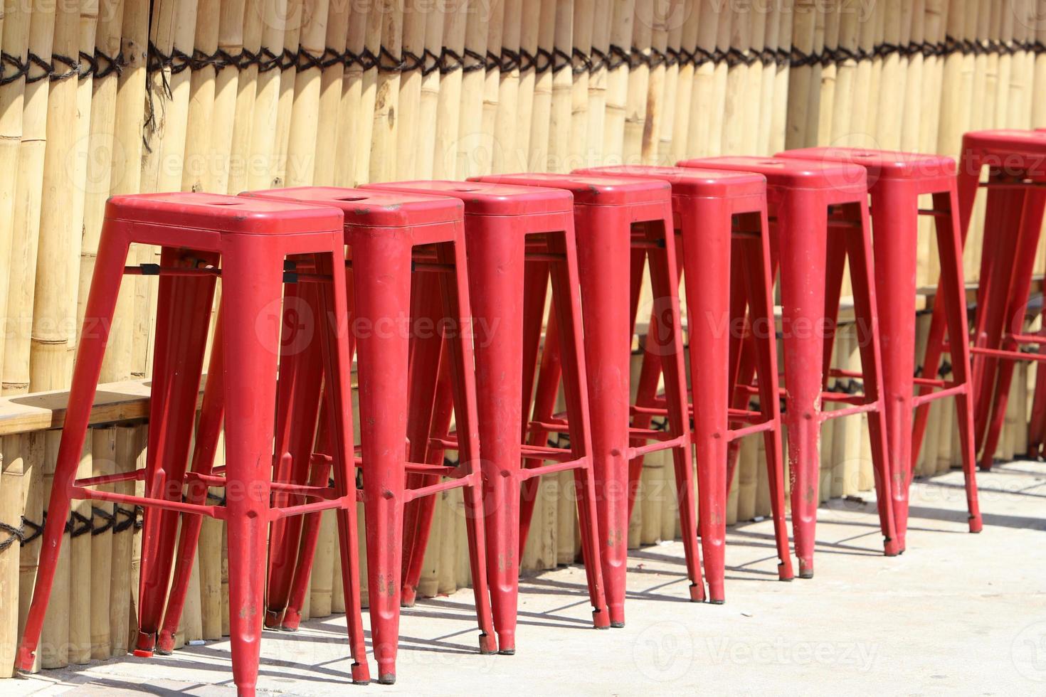 Chair and table in a cafe in a city park near the sea. photo