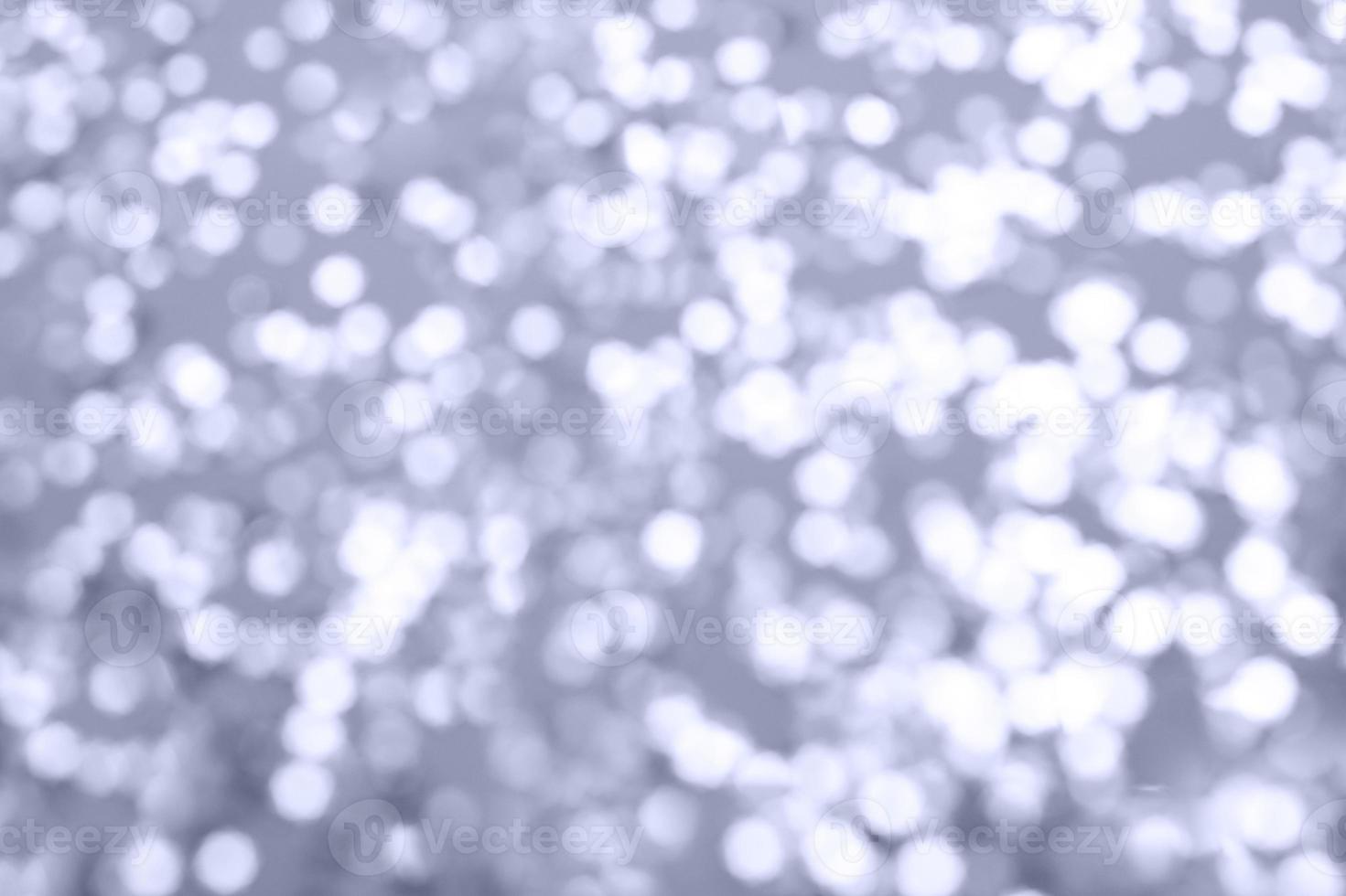 multicolor sparkles on a purple background. Festive backdrop for your projects. photo