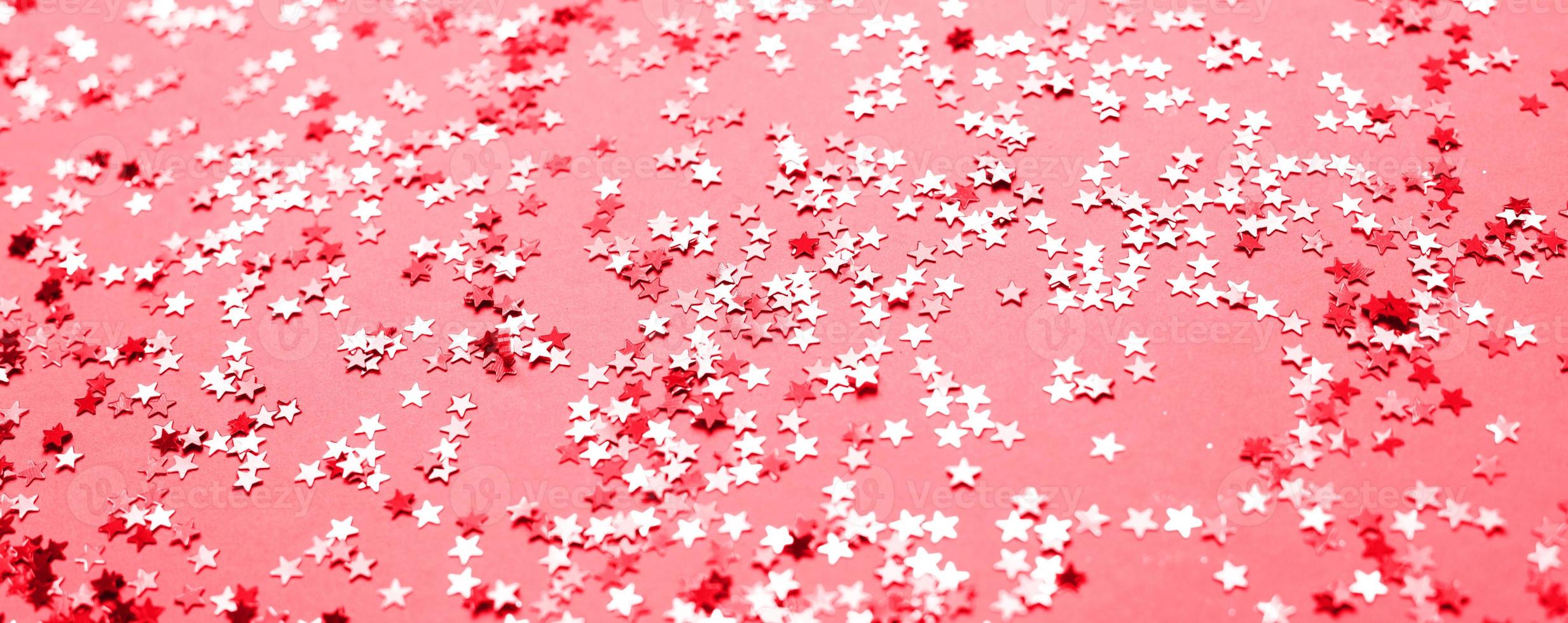 pink sparkles on a purple background. Festive backdrop for your projects. photo