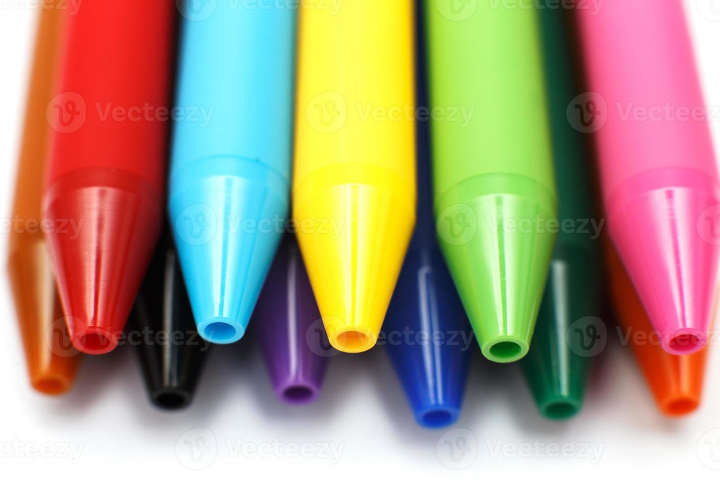 Multicolored gel pens isolated on a white background, close-up. Copy space photo