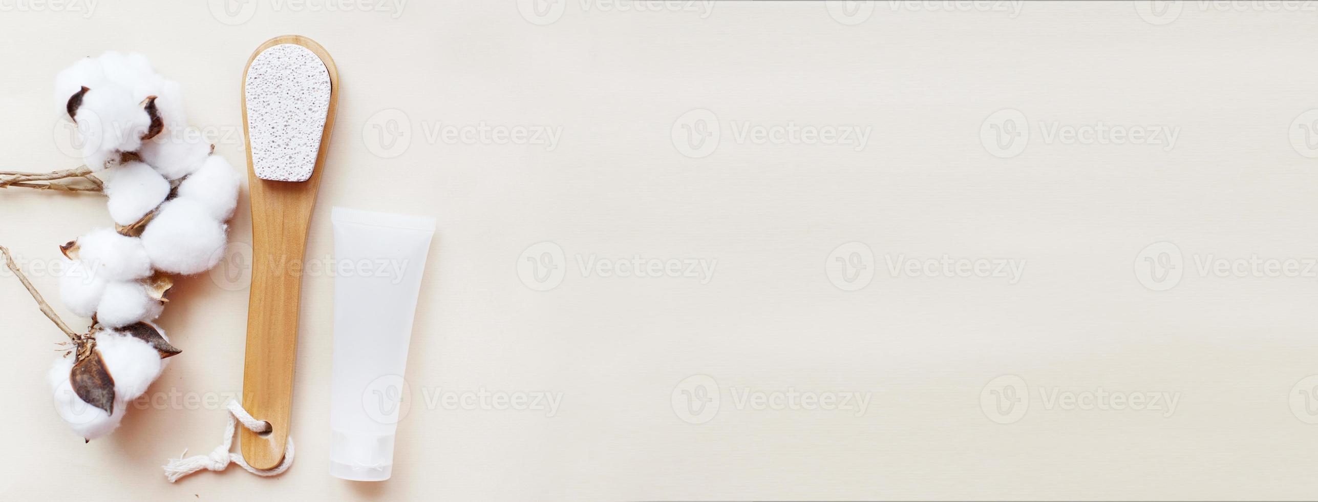 eco friendly foot pumice stone with jar of cream mockup and cotton flower on beige background photo