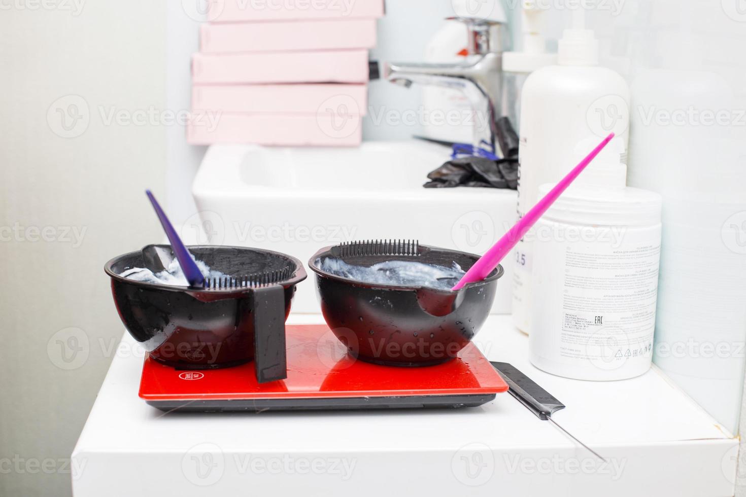 a bowl with hair dye in beauty salon close. photo