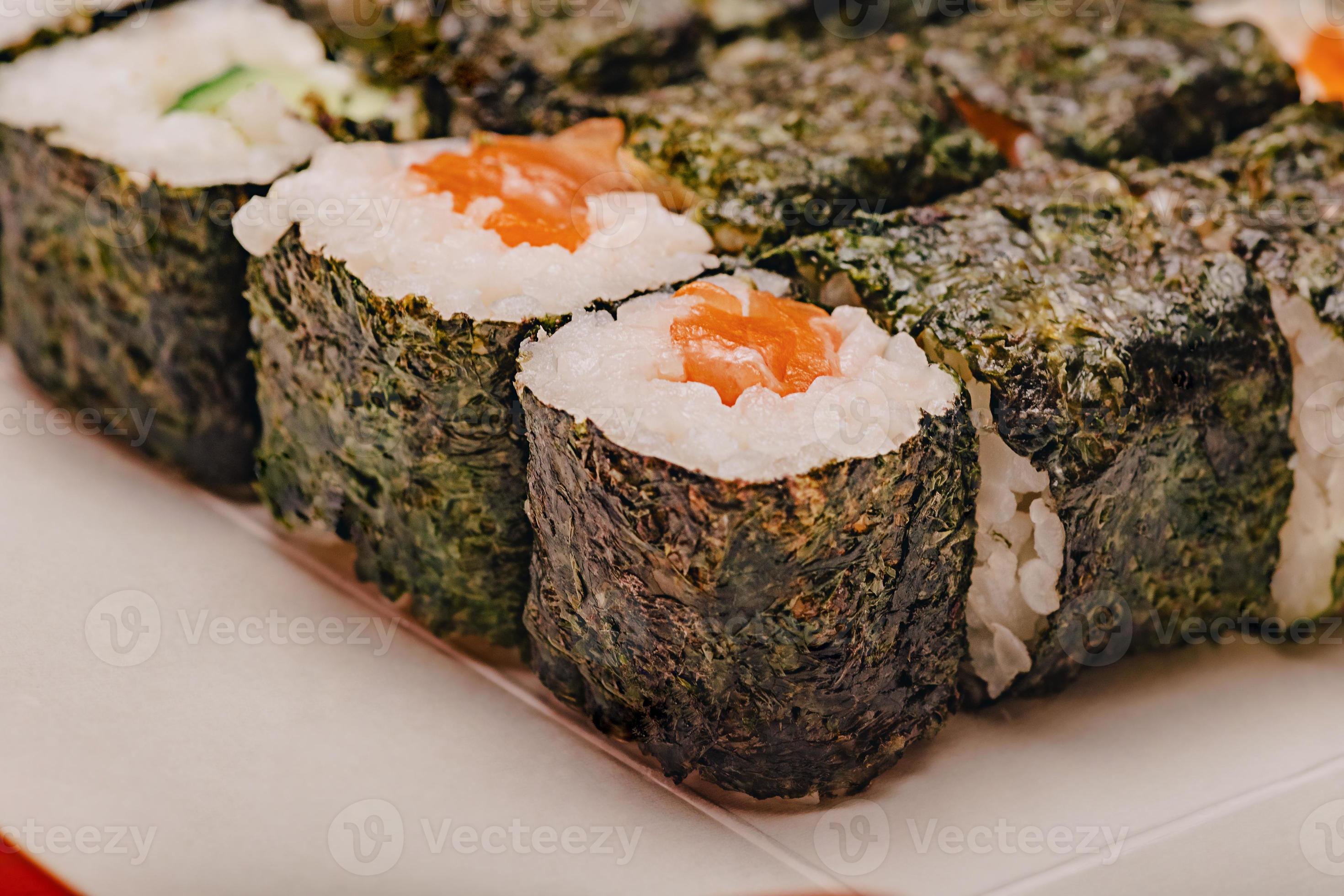 Rolls with salmon macro photo. Food delivery. Japanese cuisine rolls