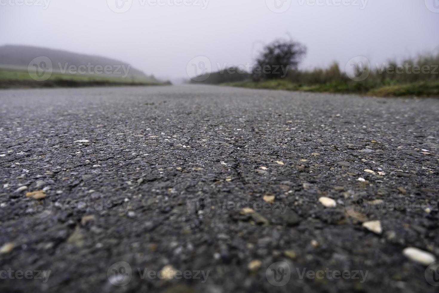 Asphalt road with fog photo
