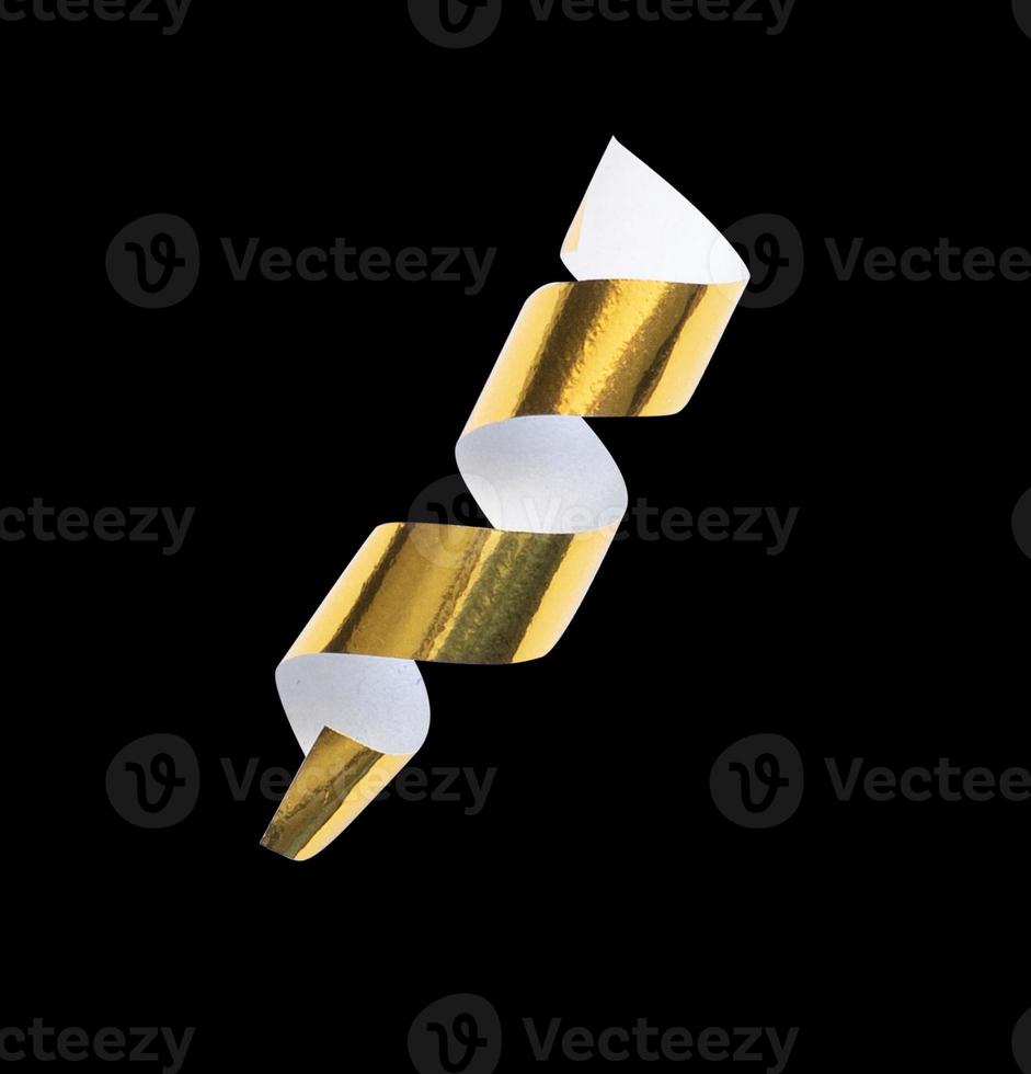 Single curly gold confetti isolated for design ornament photo