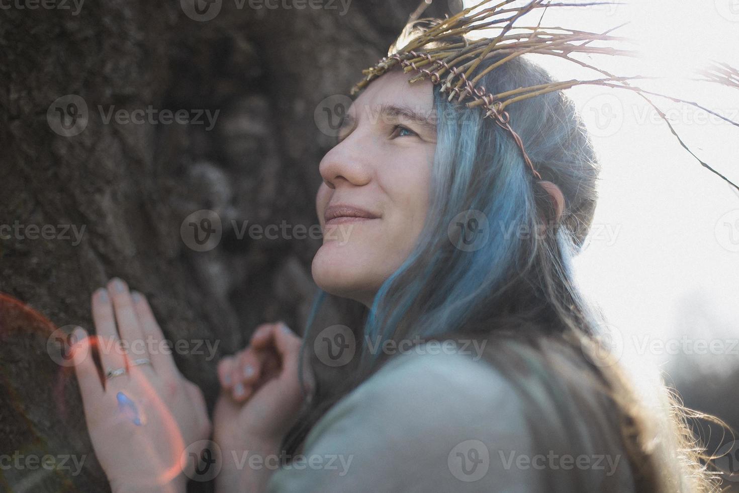 Close up pagan styled woman with sunshine halo around hair portrait picture photo