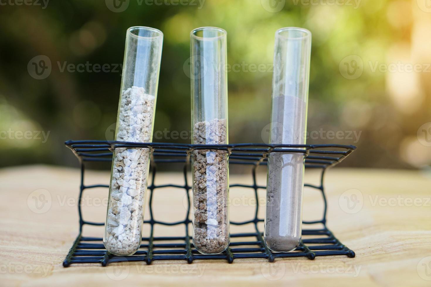 Test tubes that contain sample soil. Concept, soil quality inspection, research and science experiment. Laboratory. Find the best from different soil type and source for growing agriculture crops photo