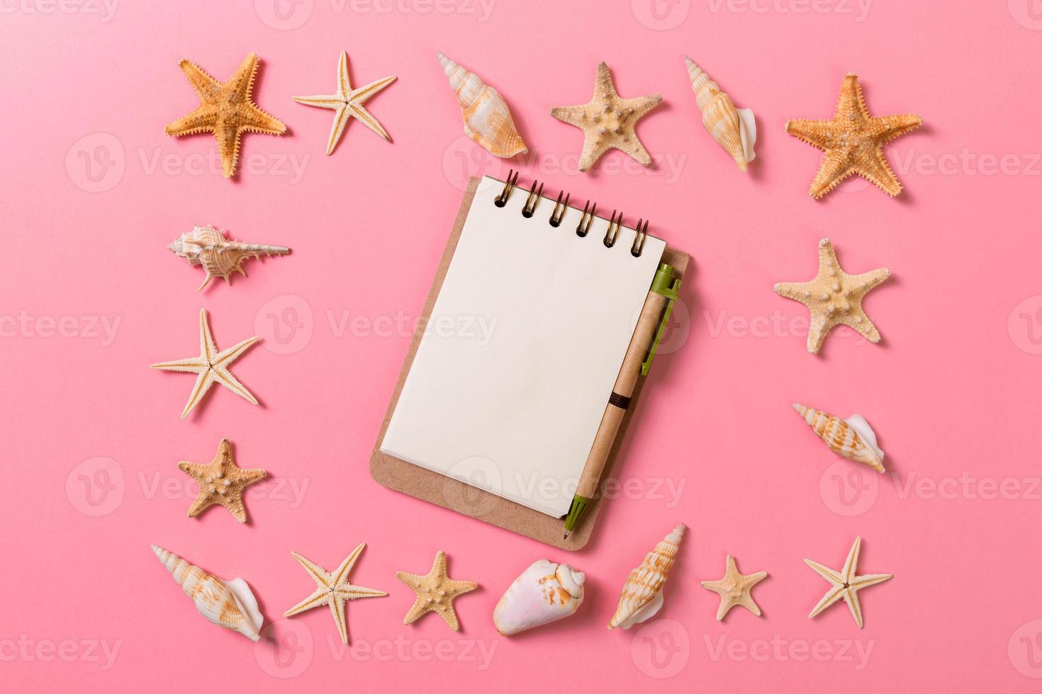 Summer holidays concept. travel background with notepad and starfish . Top view. Flat lay photo