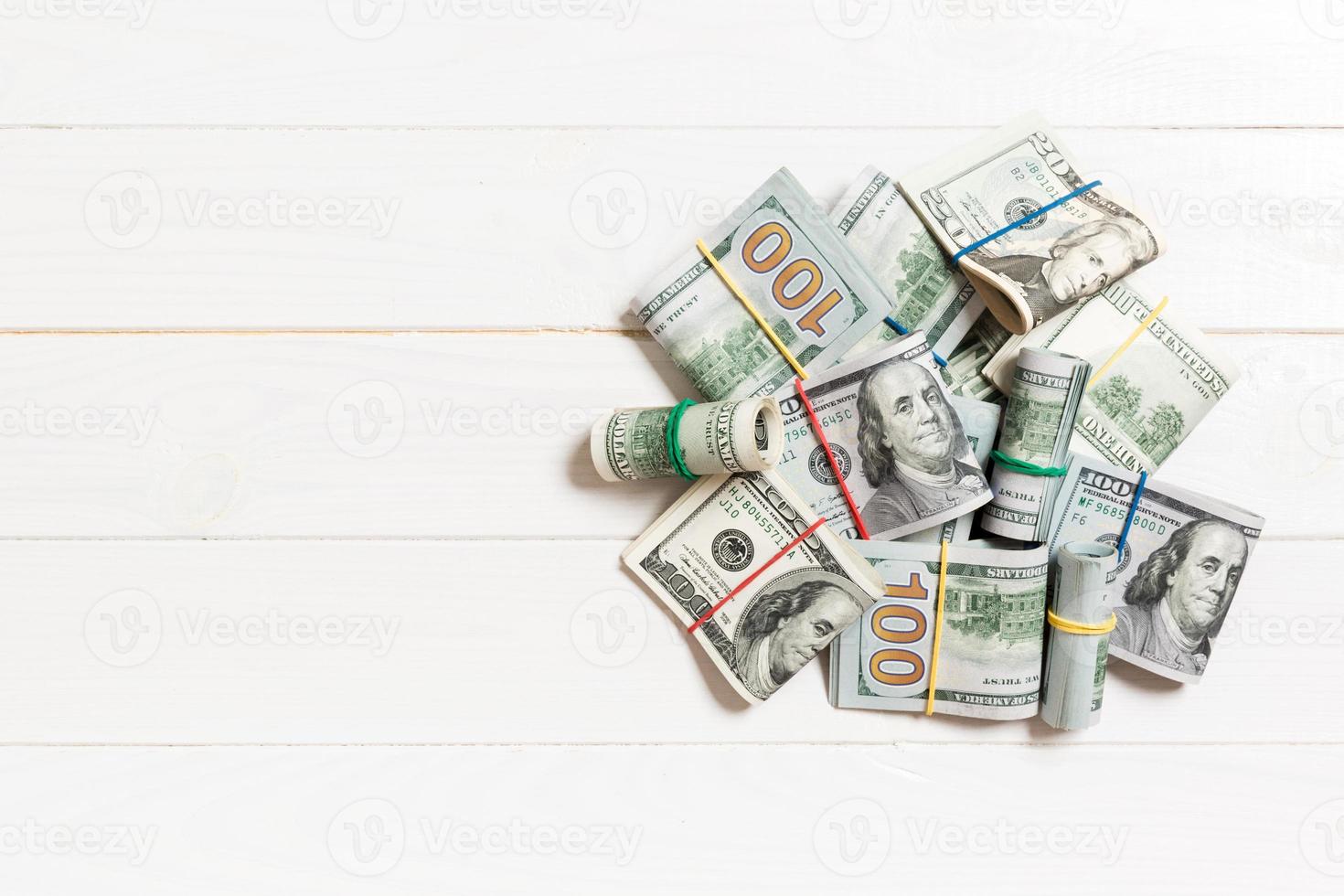 Many Stack of 100 dollar bills. Isolated on colored background top wiev with copy space photo