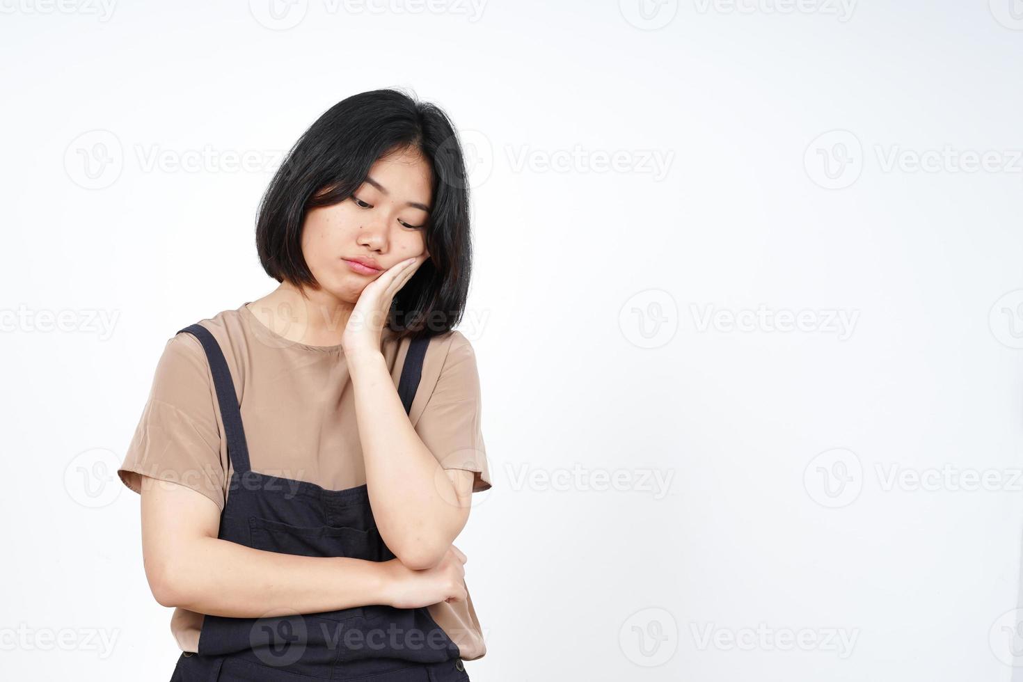 Looking down and Thinking of Beautiful Asian Woman Isolated On White Background photo