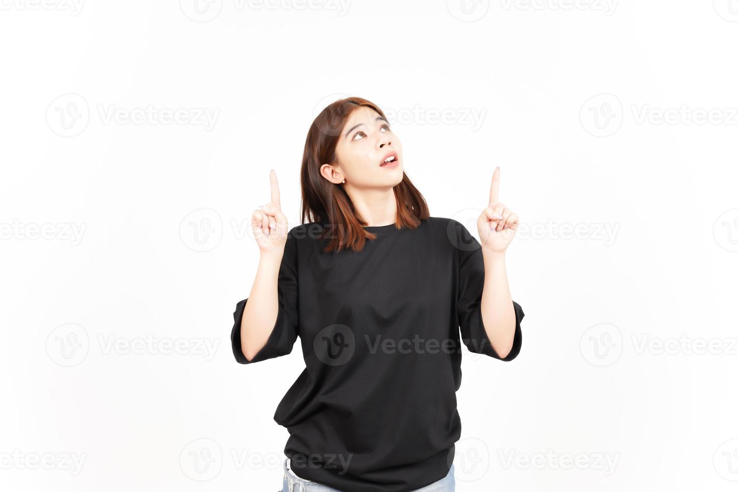 Showing Product and Pointing Up Of Beautiful Asian Woman Isolated On White Background photo